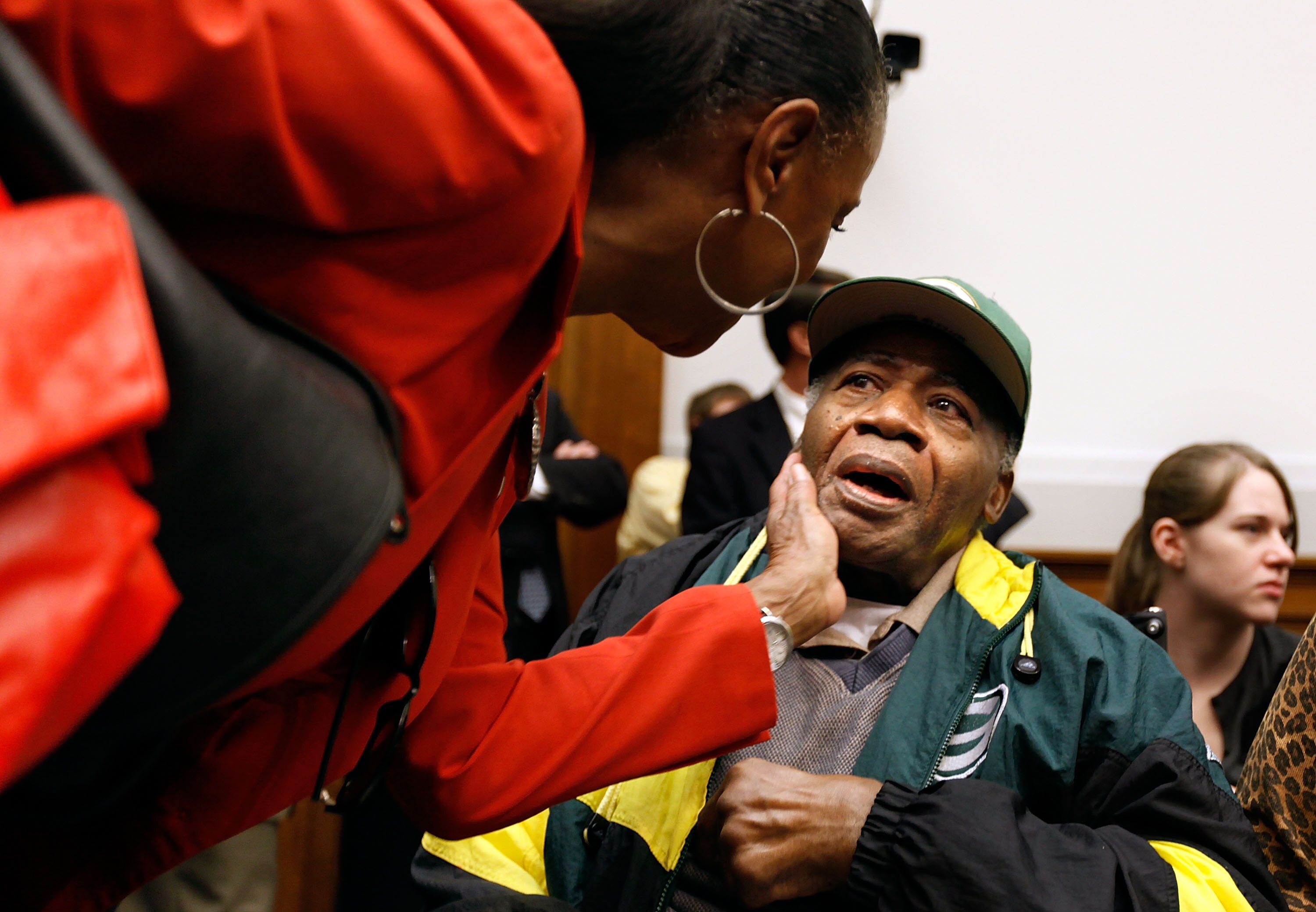WASHINGTON - OCTOBER 28:  Sylvia Mackey (L), wife of former National Football Player John Mackey, greets Pro Football Hall of Fame player Willie Woods (R) before a hearing of the House Judiciary Committee about football brain injuries on Captiol Hill Octo