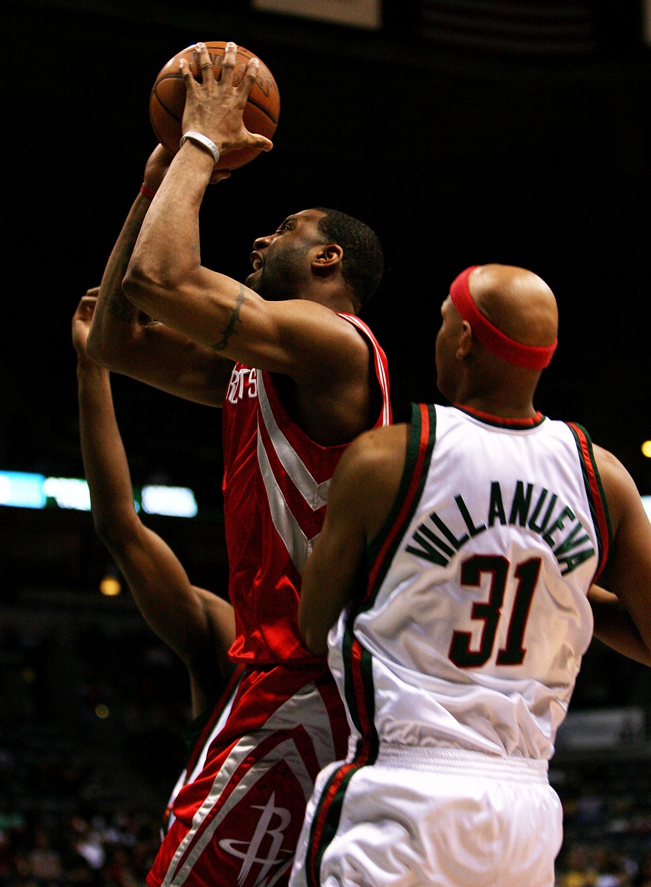 MILWAUKEE - FEBRUARY 09: Tracy McGrady #1 of the Houston Rockets drives past Charlie Villanueva #31 of the Milwaukee Bucks on February 9, 2009 at the Bradley Center in Milwaukee, Wisconsin. The Bucks defeated the Rockets 124-112. NOTE TO USER: User expres