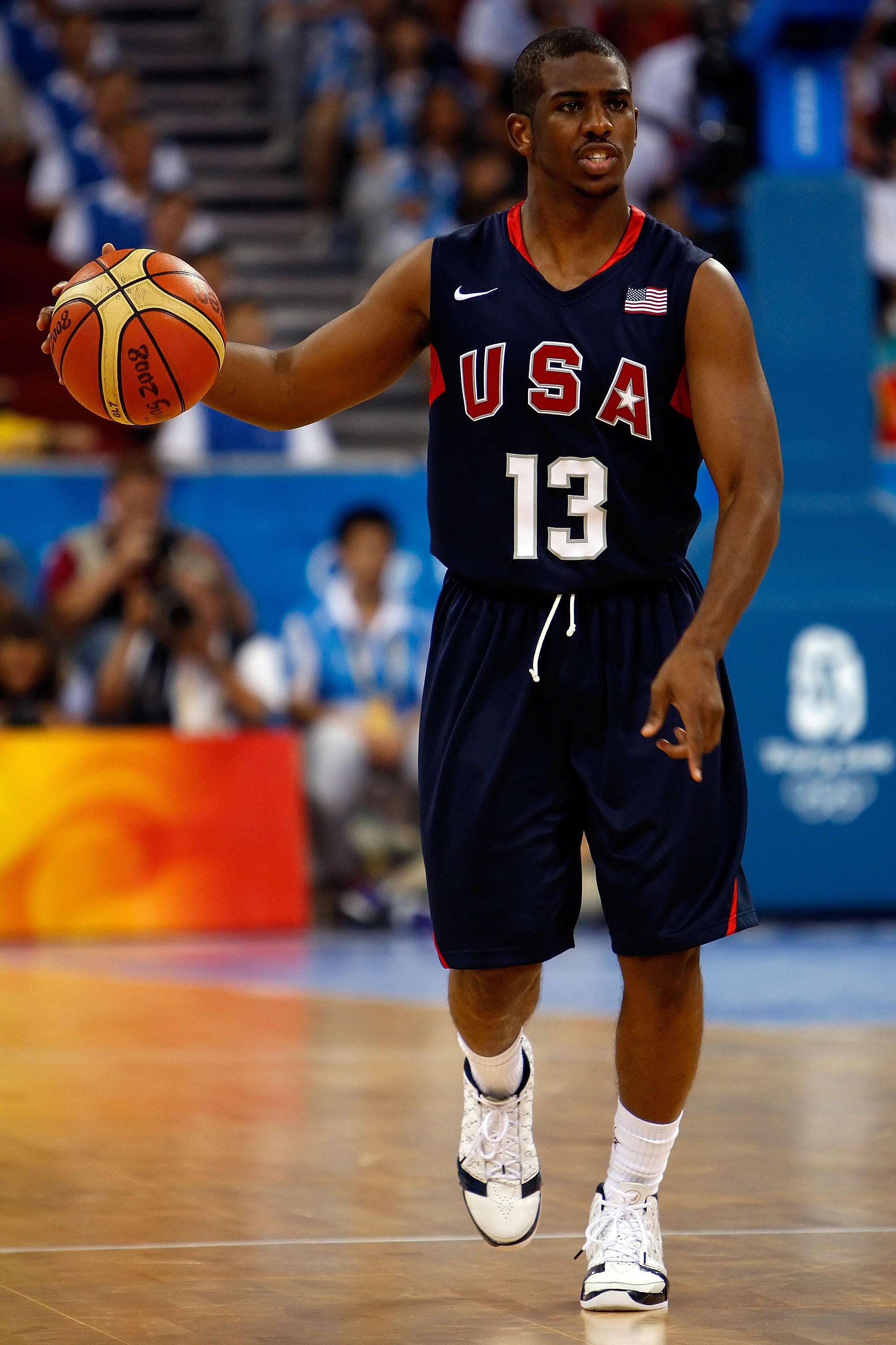BEIJING - AUGUST 24:  Chris Paul #13 of the United States brings the ball down court in the gold medal game against Spain during Day 16 of the Beijing 2008 Olympic Games at the Beijing Olympic Basketball Gymnasium on August 24, 2008 in Beijing, China.  (P