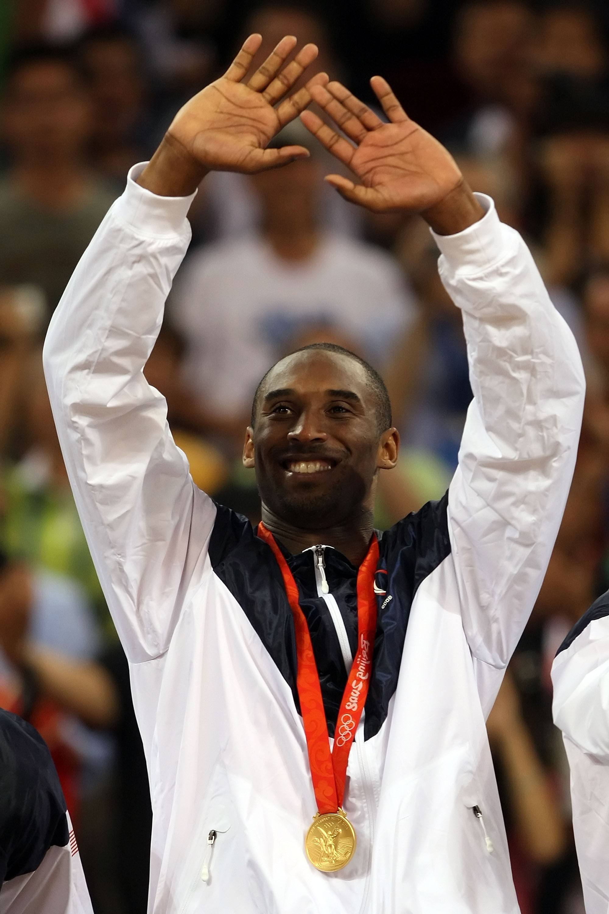 BEIJING - AUGUST 24:  Kobe Bryant #10 of the United States celebrates on the podium after defeating Spain 118-107 in the gold medal game during Day 16 of the Beijing 2008 Olympic Games at the Beijing Olympic Basketball Gymnasium on August 24, 2008 in Beij