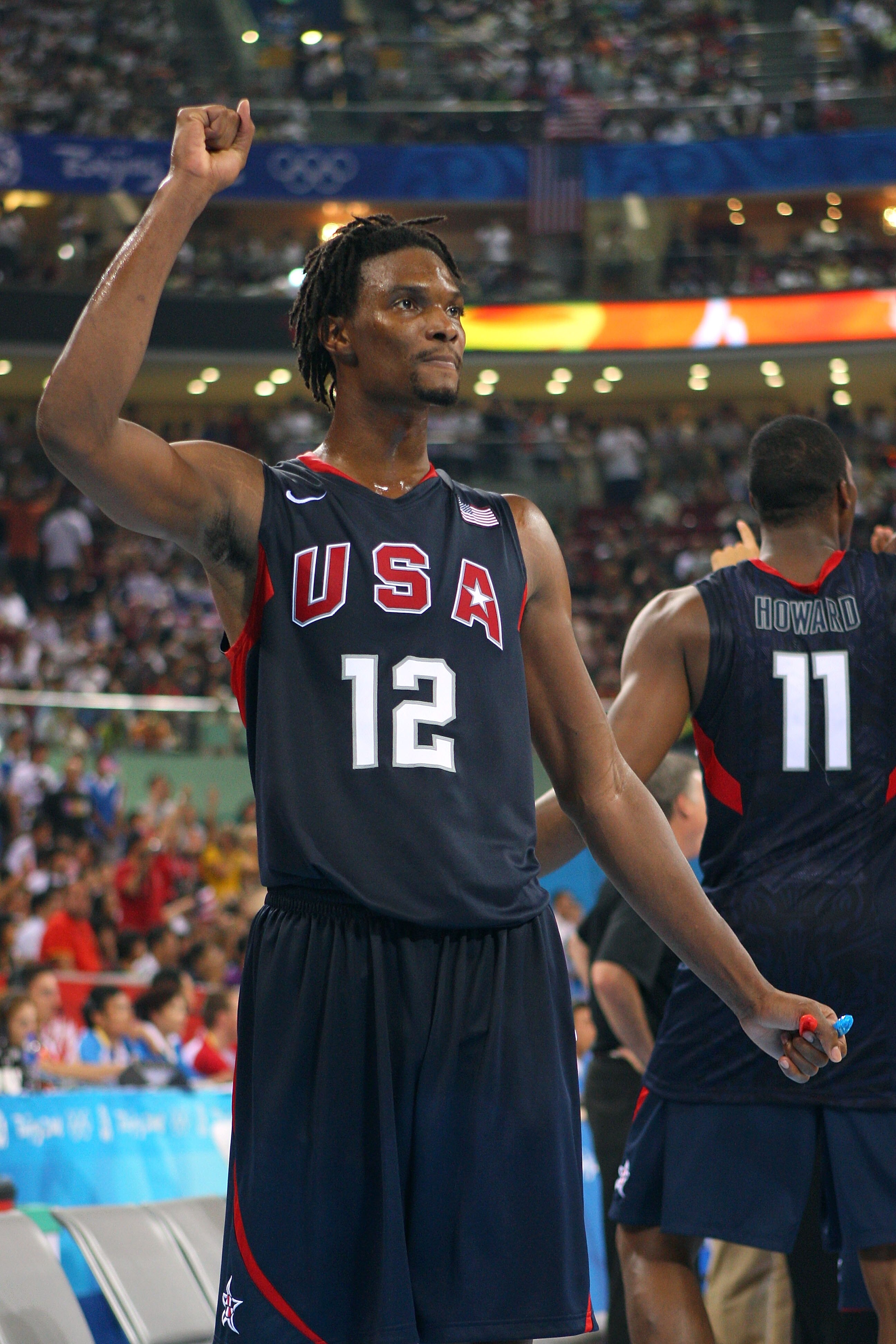 BEIJING - AUGUST 24:  Chris Bosh #12 of the United States celebrates after winning the gold medal game 118-107 over Spain during Day 16 of the Beijing 2008 Olympic Games at the Beijing Olympic Basketball Gymnasium on August 24, 2008 in Beijing, China.  (P