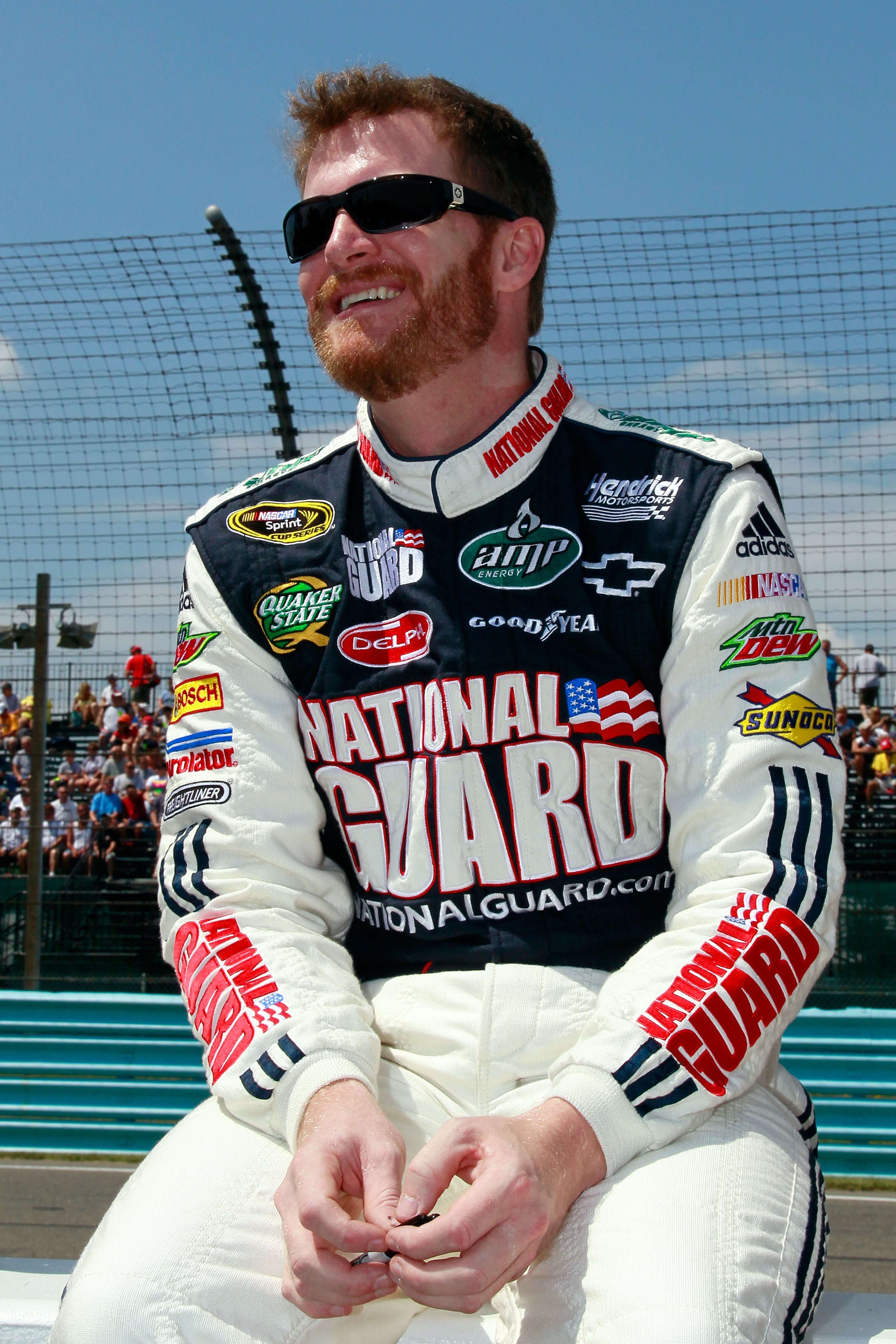 WATKINS GLEN, NY - AUGUST 08:  Dale Earnhardt Jr., driver of the #88 AMP Energy/National Guard Chevrolet, stands on the grid prior to the NASCAR Sprint Cup Series Heluva Good! Sour Cream Dips at Watkins Glen International on August 8, 2010 in Watkins Glen
