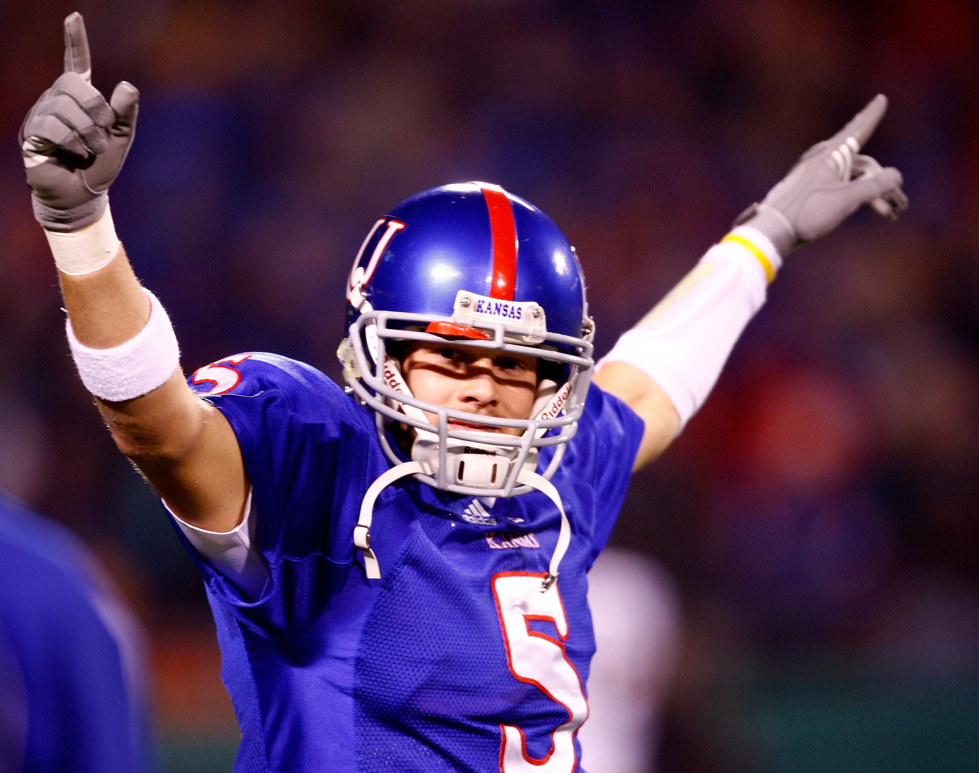 KANSAS CITY, MO - NOVEMBER 24:  Quarterback Todd Reesing #5 of the Kansas Jayhawks gets the crowd fired up during team introductions prior to the start game against the Missouri Tigers at Arrowhead Stadium November 24, 2007 in Kansas City, Missouri.  (Pho