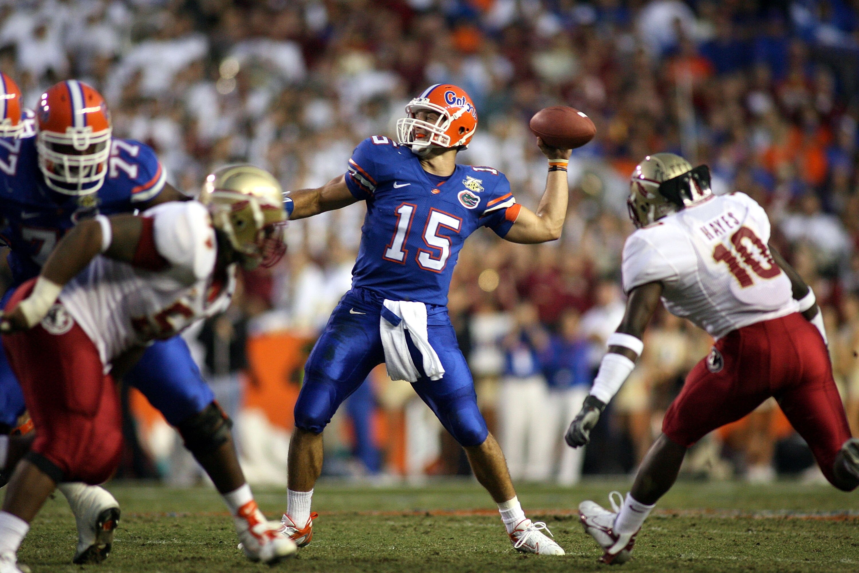 GAINESVILLE, FL - NOVEMBER 24:  Quarterback Tim Tebow #15 of the Florida Gators throws a touchdown pass against the Florida State Seminoles at Ben Hill Griffin Stadium November 24, 2007 in Gainesville, Florida.  (Photo by Marc Serota/Getty Images)