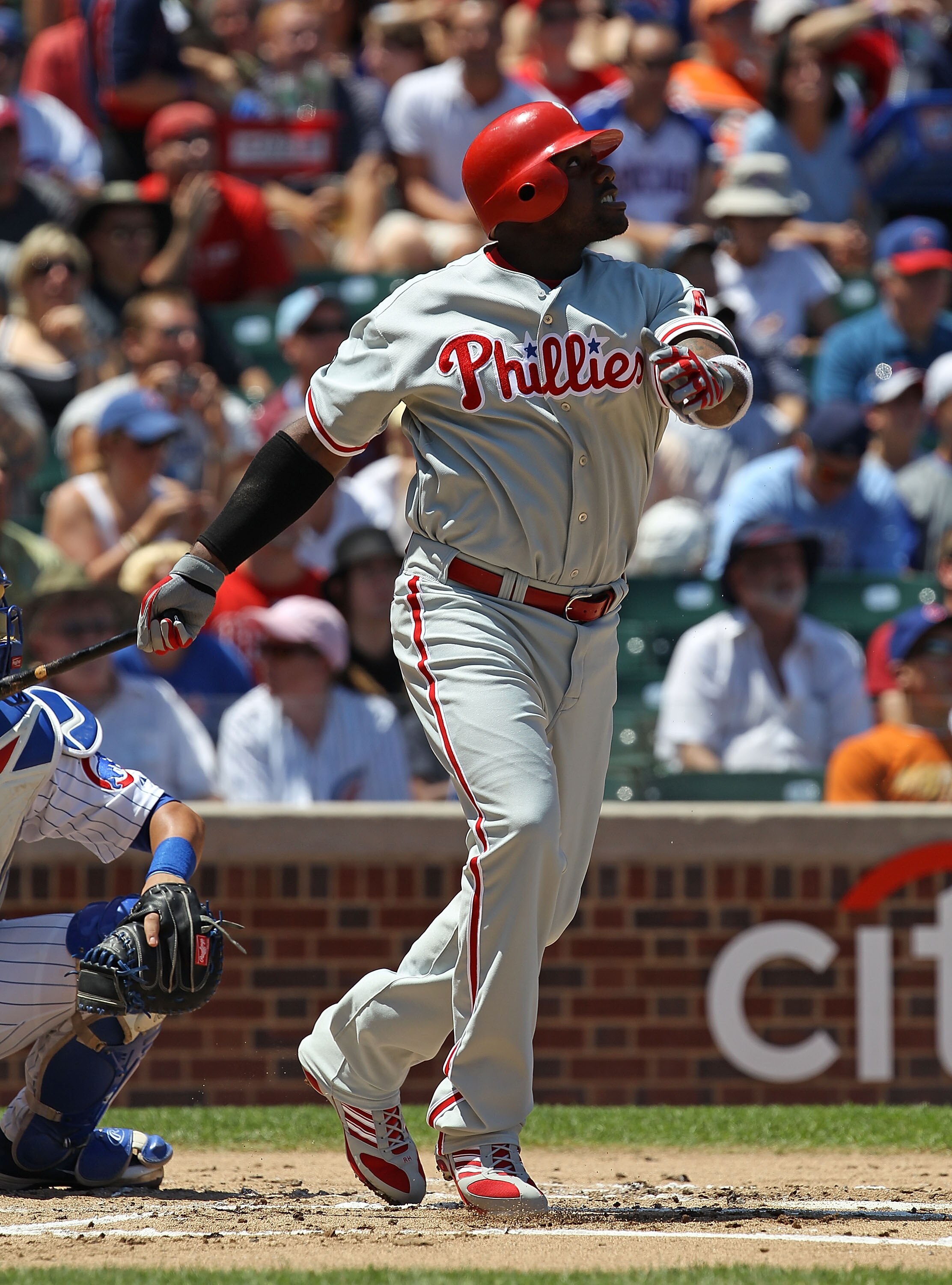 CHICAGO - JULY 16: Ryan Howard #6 of the Philadelphia Phillies watches the flight of the ball against the Chicago Cubs at Wrigley Field on July 16, 2010 in Chicago, Illinois. The Cubs defeated the Phillies 4-3. (Photo by Jonathan Daniel/Getty Images)