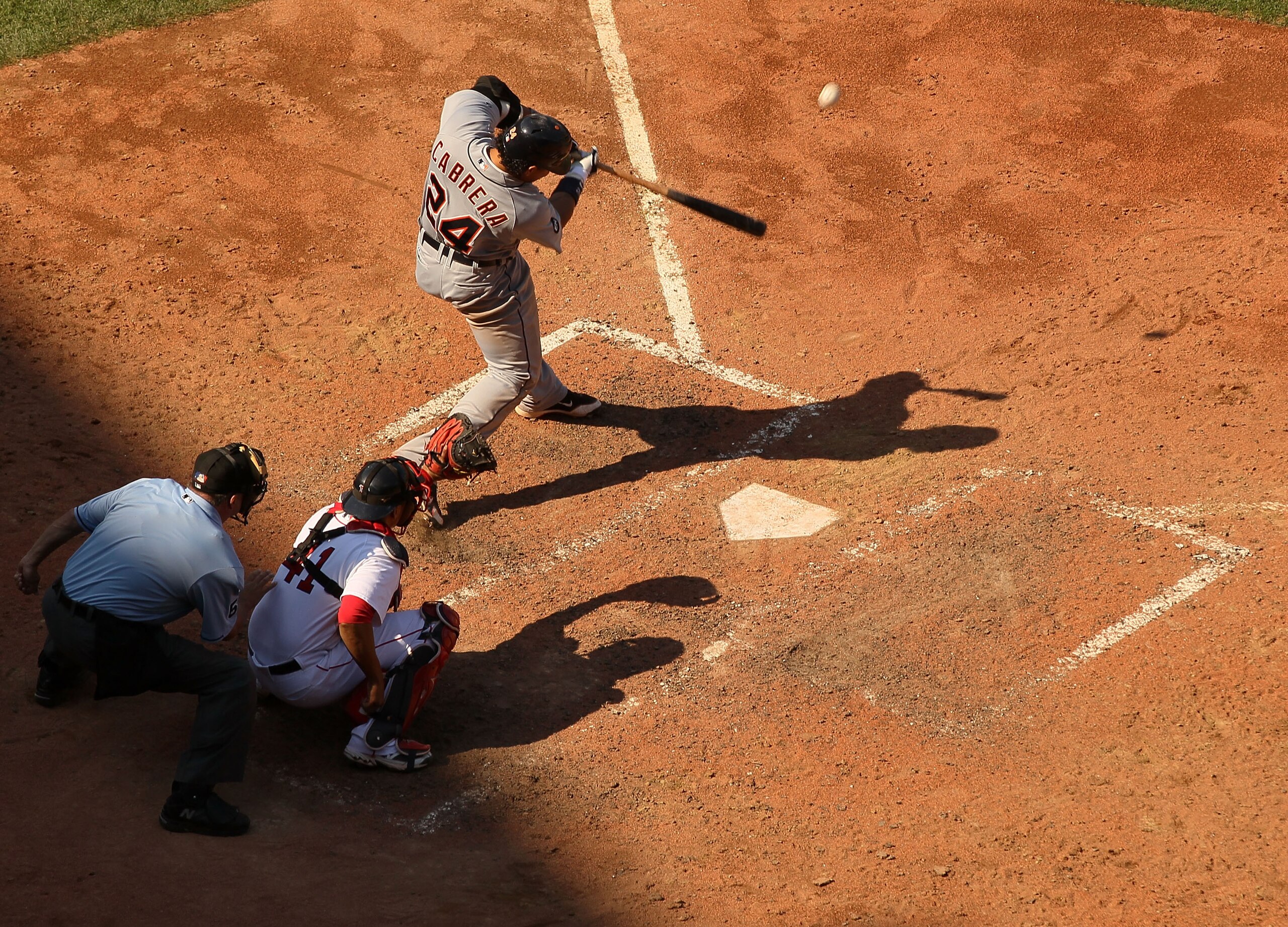 BOSTON - AUGUST 01: Miguel Cabrera #24 of the Detroit Tigers hits an RBI double in the ninth inning as Victor Martinez #41 of the Boston Red Sox defends on August 1, 2010 at Fenway Park in Boston, Massachusetts. The Red Sox defeated the Tigers 4-3. (Pho BOSTON - AUGUST 01: Miguel Cabrera #24 of the Detroit Tigers hits an RBI double in the ninth inning as Victor Martinez #41 of the Boston Red Sox defends on August 1, 2010 at Fenway Park in Boston, Massachusetts. The Red Sox defeated the Tigers 4-3. (Pho