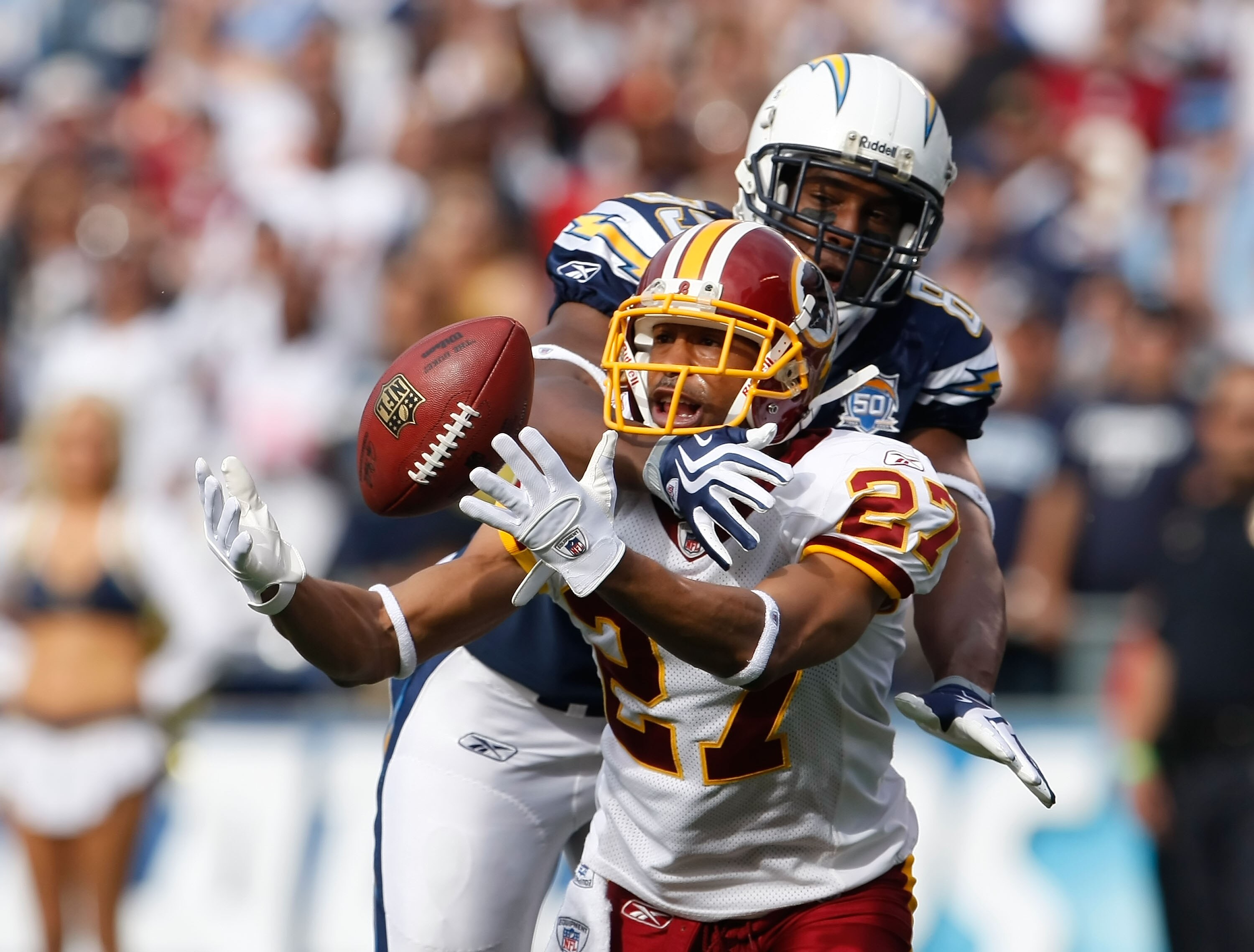 SAN DIEGO - JANUARY 03:  Fred Smoot #27 of the Washington Redskins breaks up a pass intended for Antonio Gates #85 of the San Diego Chargers in the first quarter at Qualcomm Stadium on January 3, 2010 in San Diego, California.  (Photo by Jeff Gross/Getty