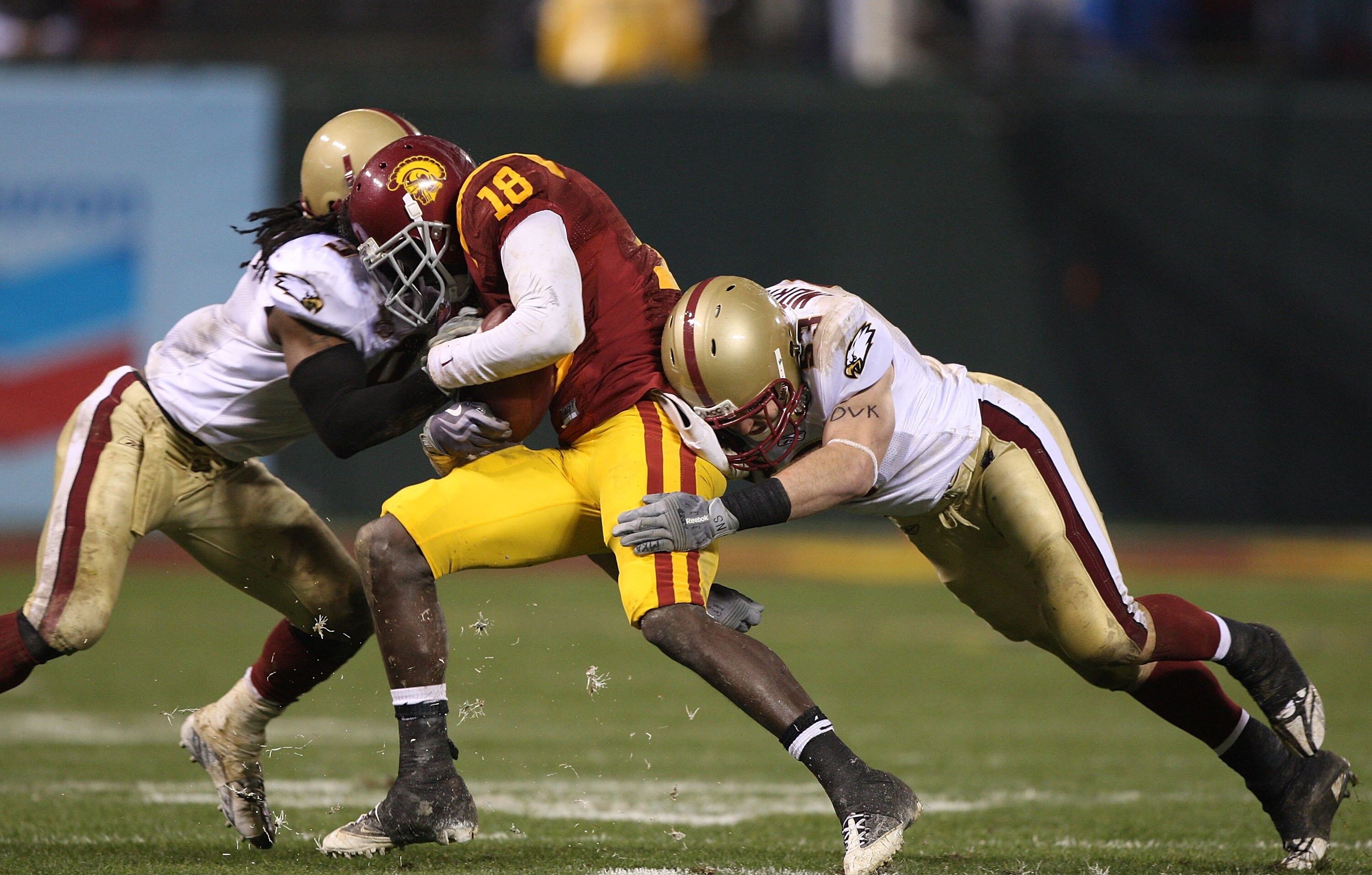SAN FRANCISCO - DECEMBER 26: Damian Williams #18 of the USC Trojans catches a pass against DeLeon Gause #9 and Mike Morrissey #53 of the Boston College Eagles during the 2009 Emerald Bowl at AT&T Park on December 26, 2009 in San Francisco, California. (Ph