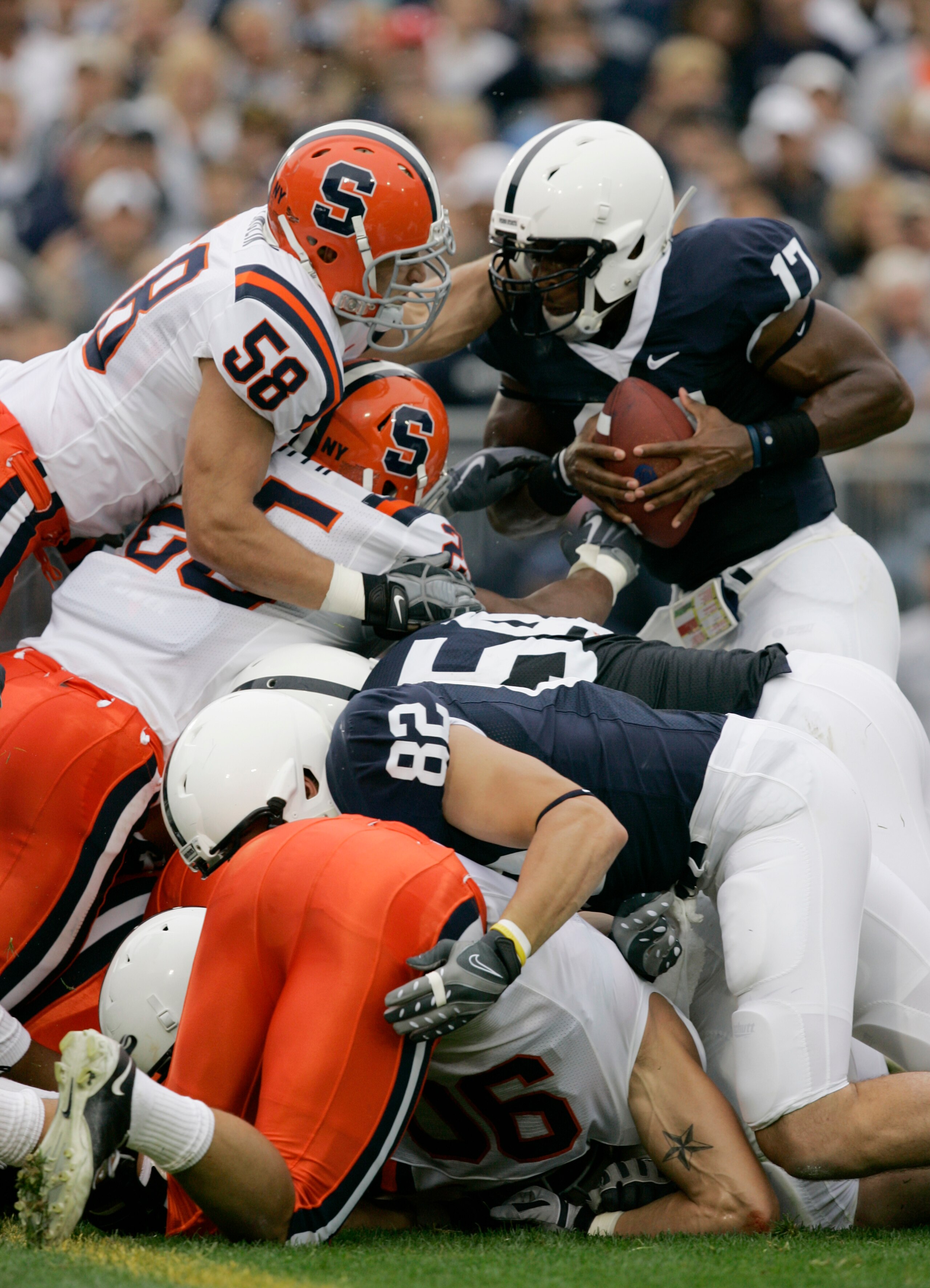 STATE COLLEGE, PA - SEPTEMBER 12: Quarterback Daryll Clark #17 of the Penn State Nittany Lions is stopped on the goal line by linebacker Mike Stenclik of the Syracuse Orangemen during the first half at Beaver Stadium  September 12, 2009 in State College, 