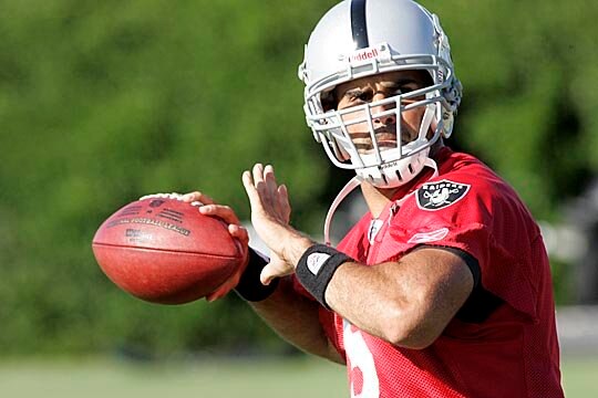 Bruce Gradkowski warms up in training camp.
