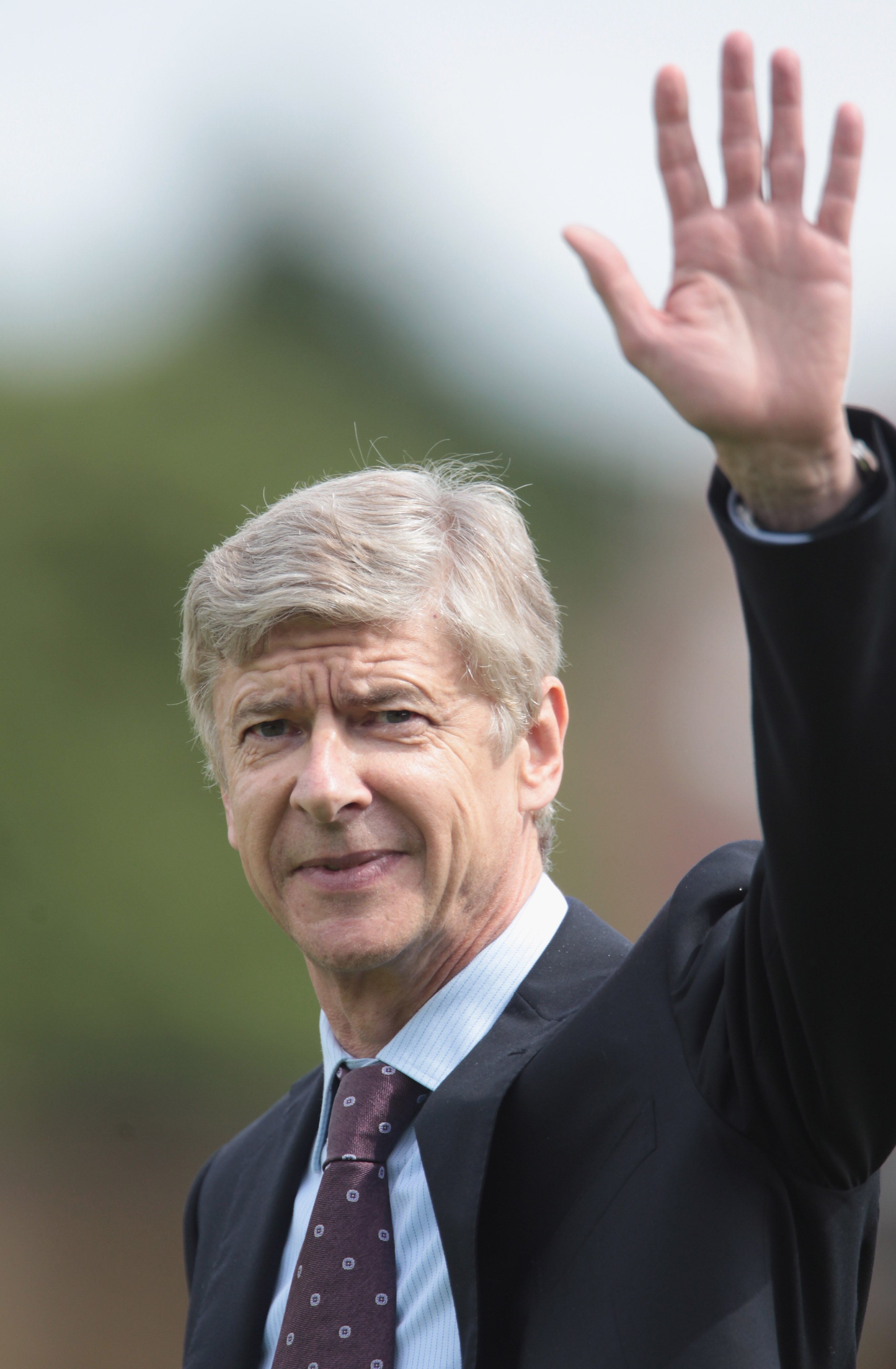 LONDON, ENGLAND - JULY 17:  Manager Arsene Wenger of Arsenal waves during the pre-season friendly match between Barnet and Arsenal at Underhill on July 17, 2010 in London, England.  (Photo by Phil Cole/Getty Images)