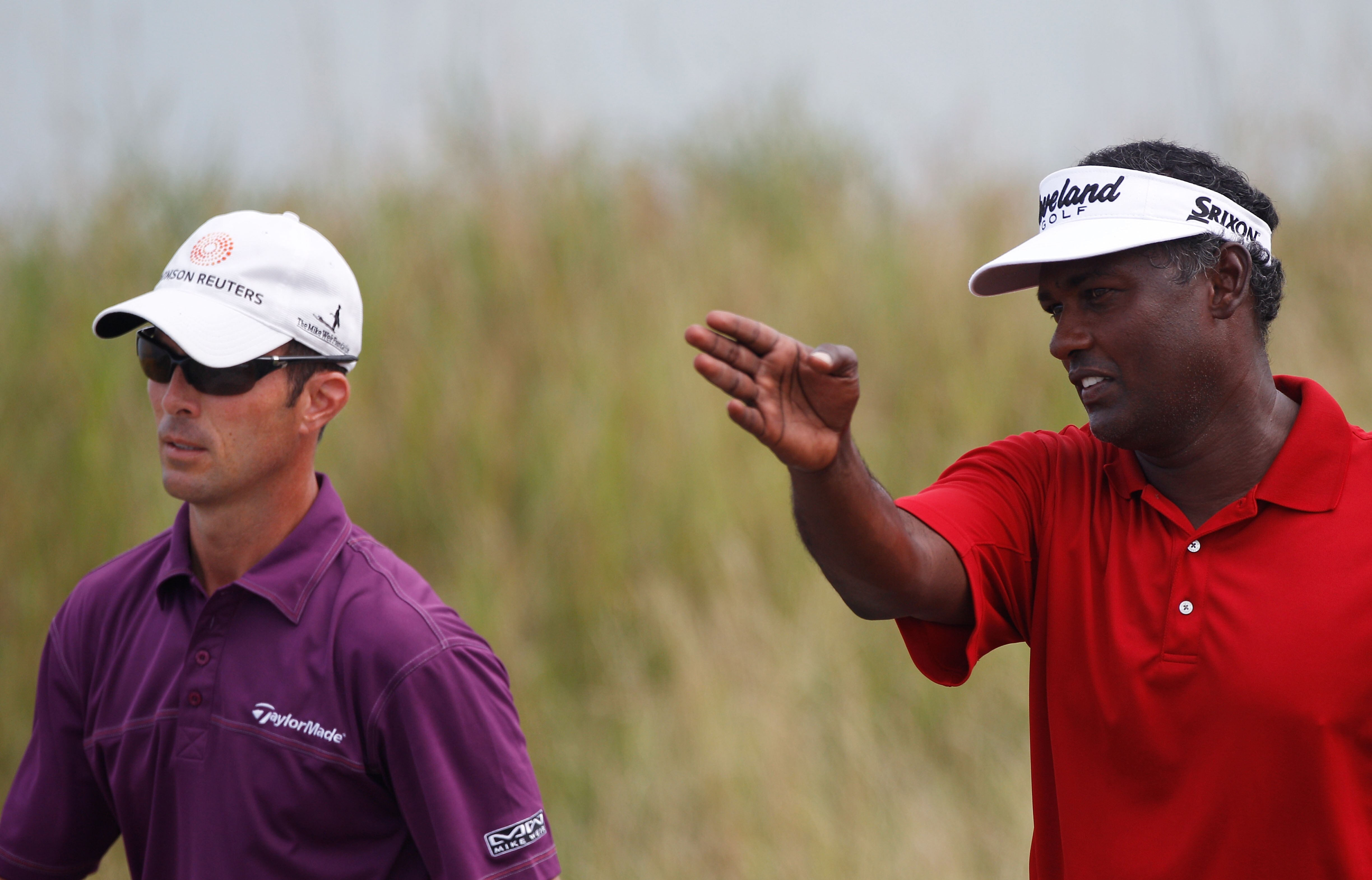 KOHLER, WI - AUGUST 10:  Vijay Singh of Fiji (R) talks with Mike Weir of Canada (L) during a practice round prior to the start of the 92nd PGA Championship on the Straits Course at Whistling Straits on August 10, 2010 in Kohler, Wisconsin.  (Photo by Chri
