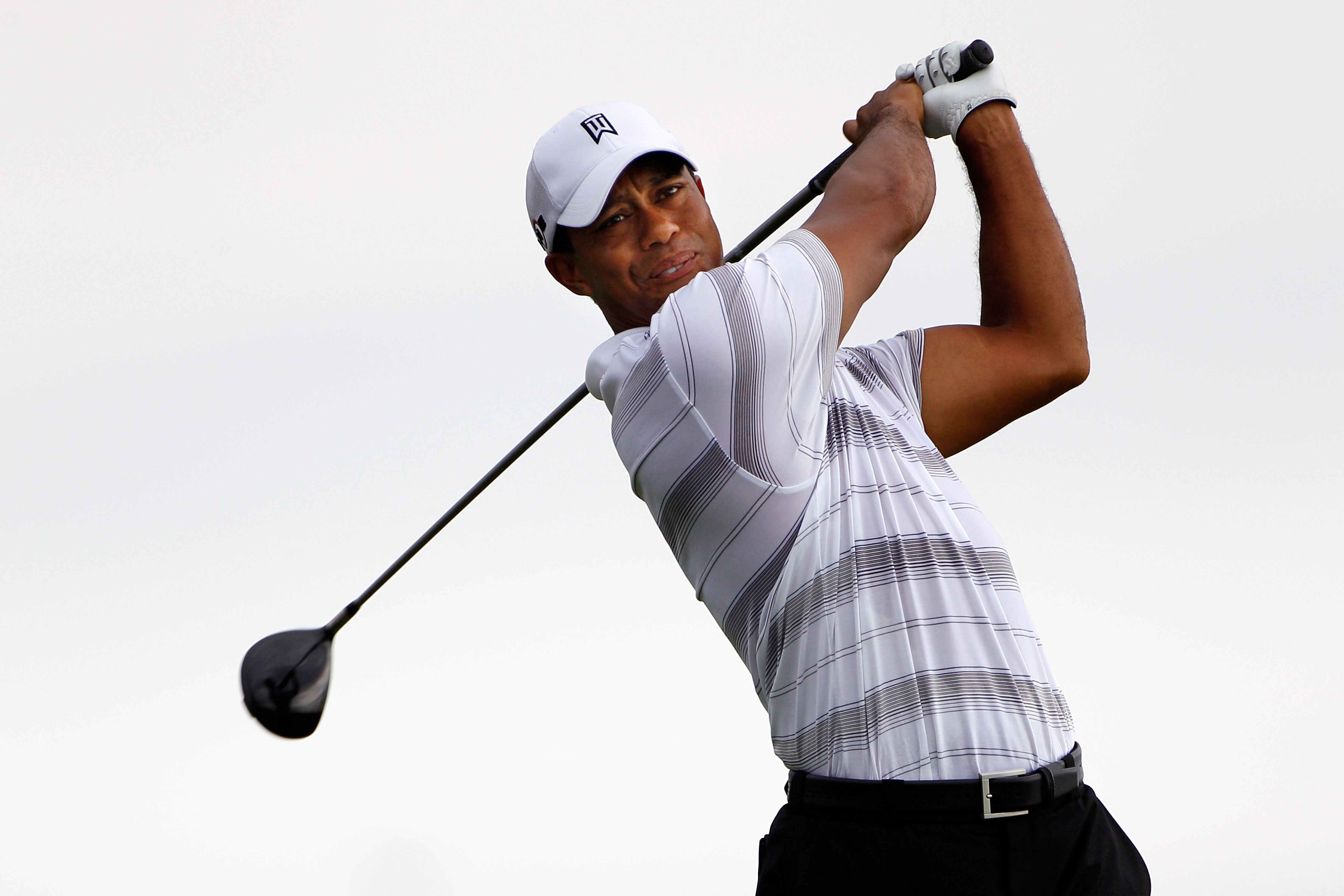 KOHLER, WI - AUGUST 11:  Tiger Woods plays a shot during a practice round prior to the start of the 92nd PGA Championship on the Straits Course at Whistling Straits on August 11, 2010 in Kohler, Wisconsin.  (Photo by Sam Greenwood/Getty Images)