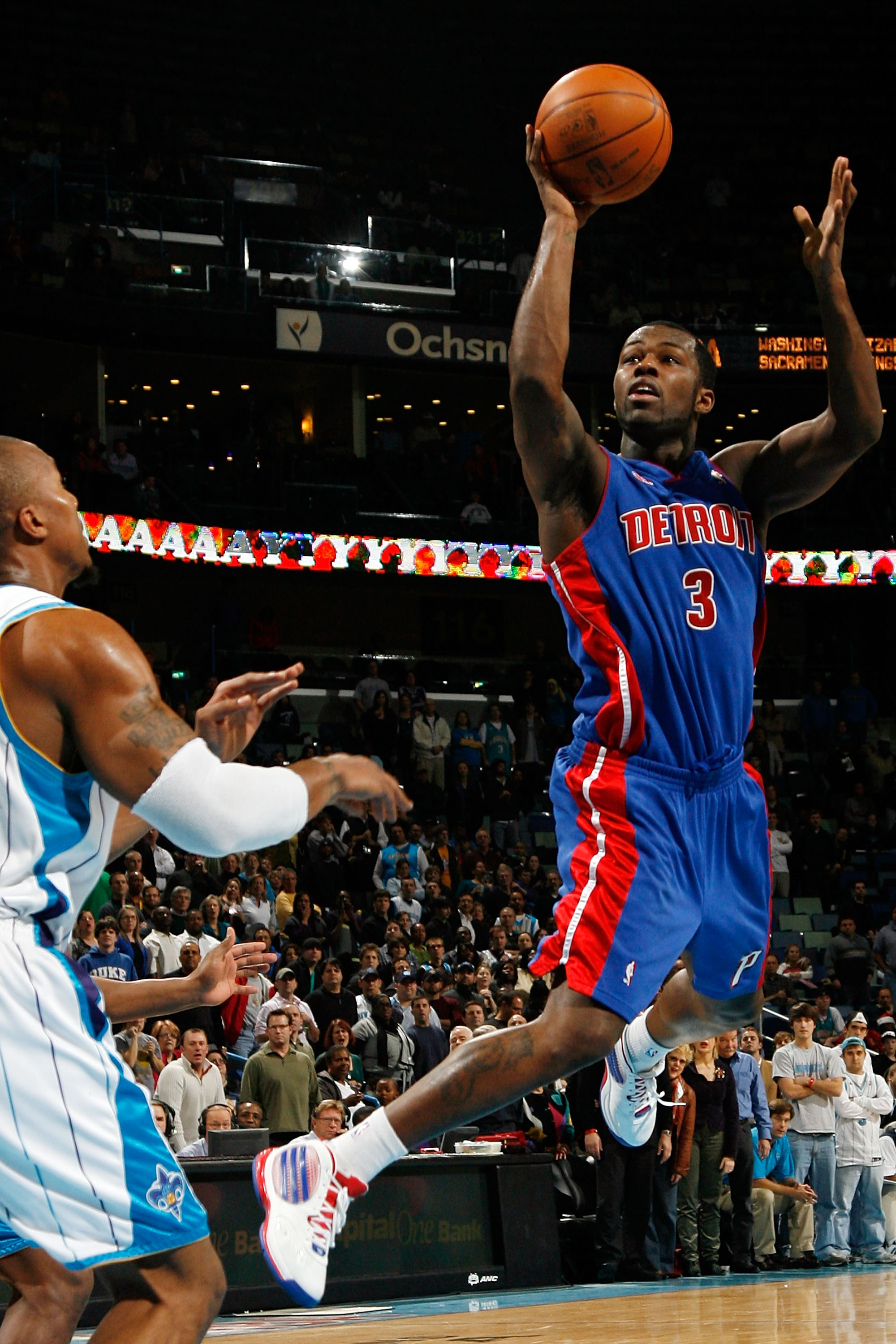 NEW ORLEANS - DECEMBER 16:  Rodney Stuckey #3 of the Detroit Pistons makes a shot over David West #30 of the New Orleans Hornets at New Orleans Arena on December 16, 2009 in New Orleans, Louisiana.  The Hornets defeated the Pistons 95-87. NOTE TO USER: Us