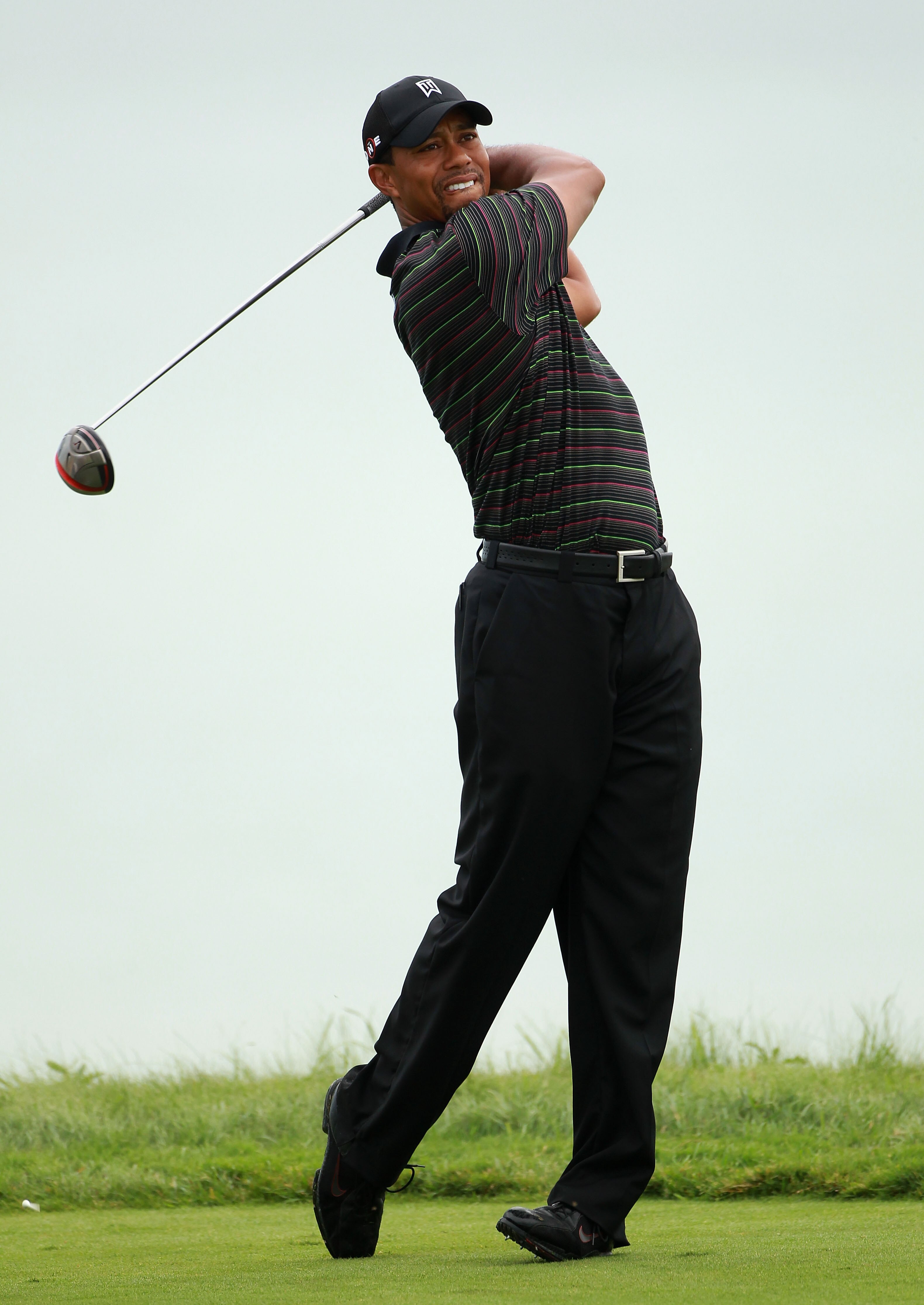 KOHLER, WI - AUGUST 09:  Tiger Woods plays a shot during a practice round prior to the start of the 92nd PGA Championship on the Straits Course at Whistling Straits on August 9, 2010 in Kohler, Wisconsin.  (Photo by Andrew Redington/Getty Images)