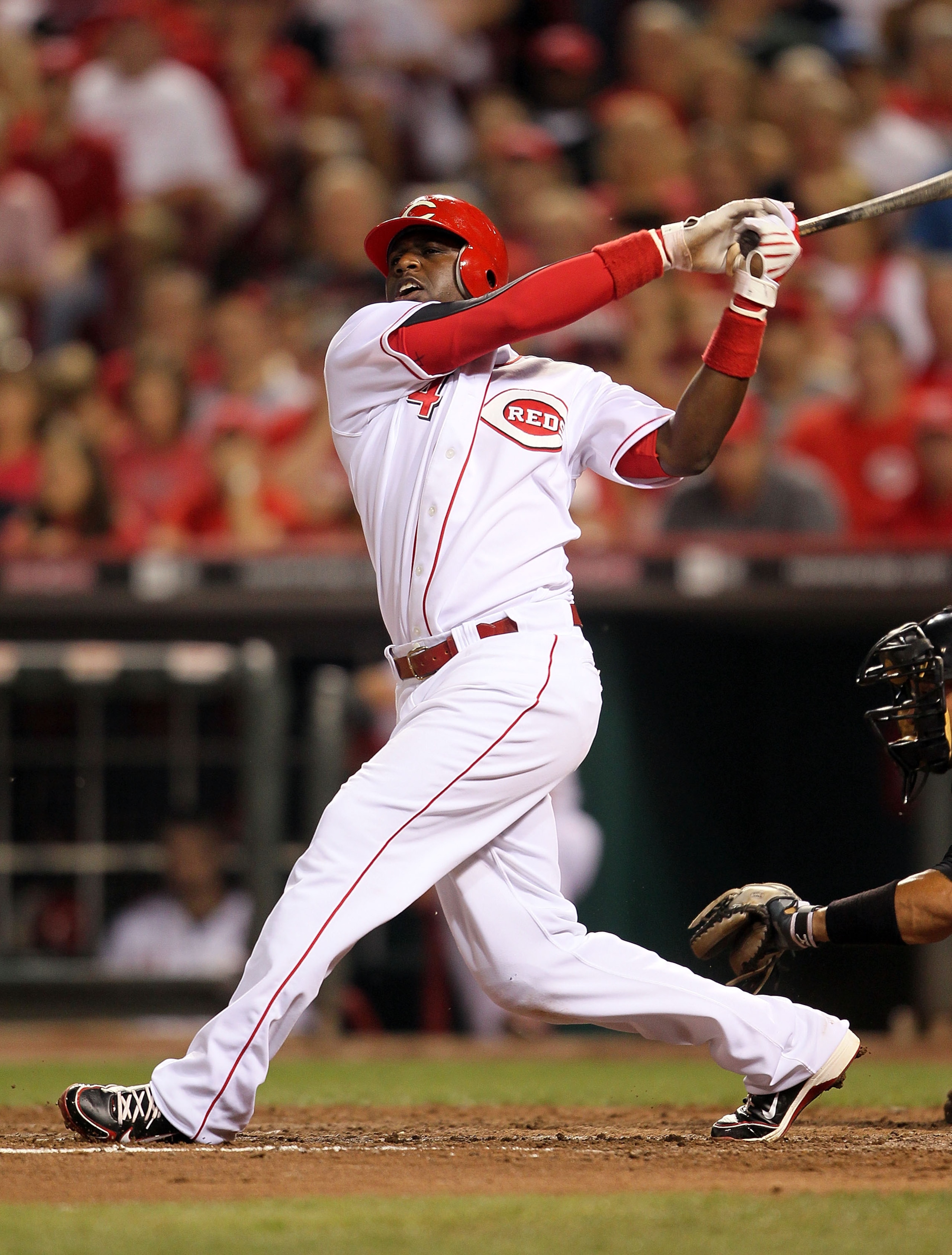 CINCINNATI - JULY 17:  Brandon Phillips #4 of the Cincinnati Reds swings at a pitch during the game against the Colorado Rockies at Great American Ball Park on July 17, 2010 in Cincinnati, Ohio.  (Photo by Andy Lyons/Getty Images)