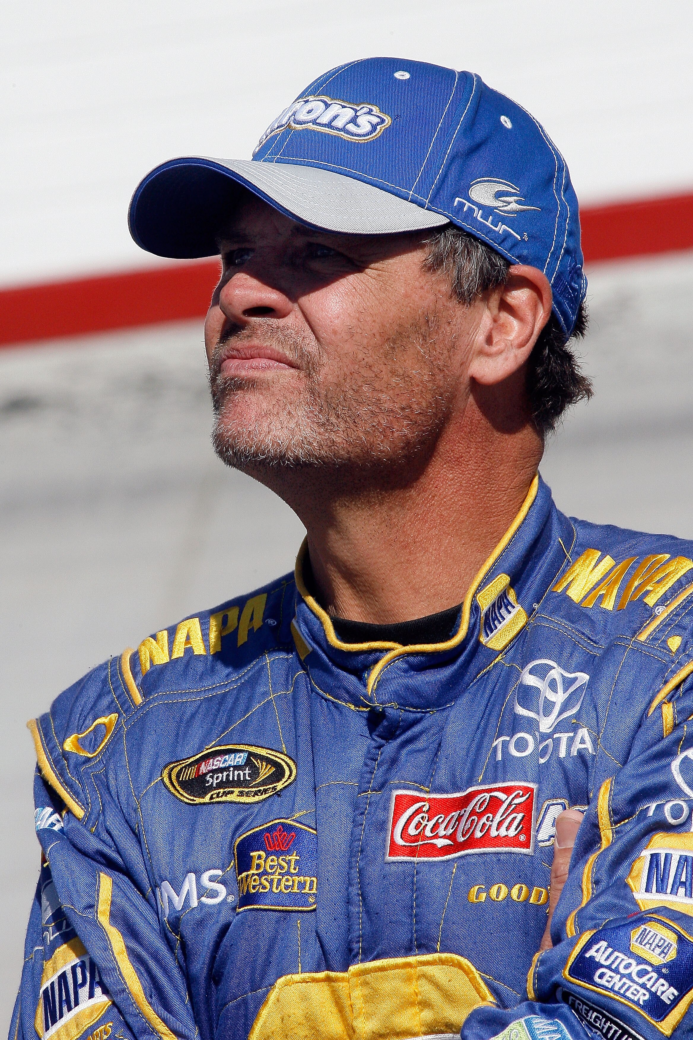 BRISTOL, TN - MARCH 19:  Michael Waltrip, driver of the #55 PRISM Motorsports Toyota, stands on the grid during qualifying for the NASCAR Sprint Cup Series Food City 500 at Bristol Motor Speedway on March 19, 2010 in Bristol, Tennessee.  (Photo by Tom Whi