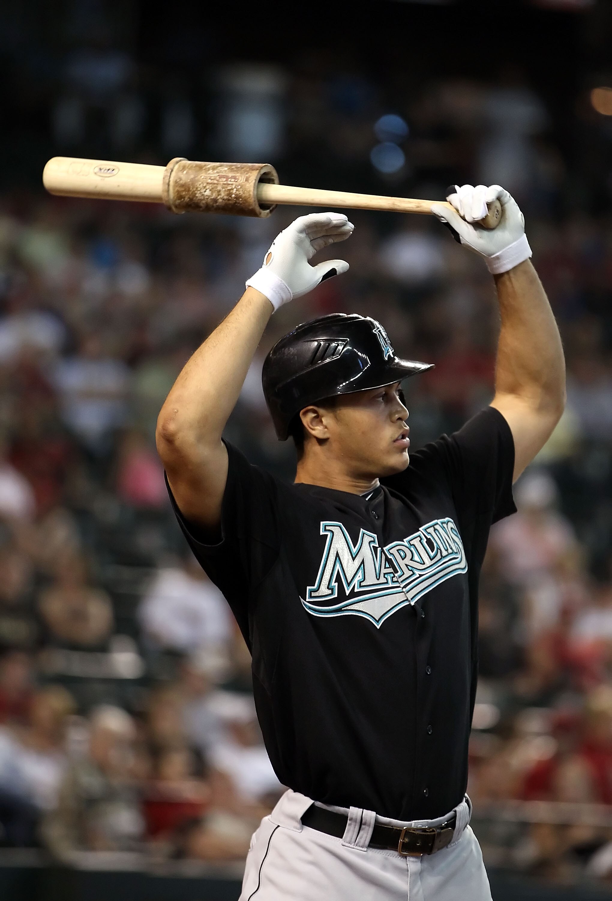 PHOENIX - JULY 11:  Mike Stanton #27 of the Florida Marlins warms up on deck during the Major League Baseball game against the Arizona Diamondbacks at Chase Field on July 11, 2010 in Phoenix, Arizona.  The Marlins defeated the Diamondbacks 2-0.  (Photo by