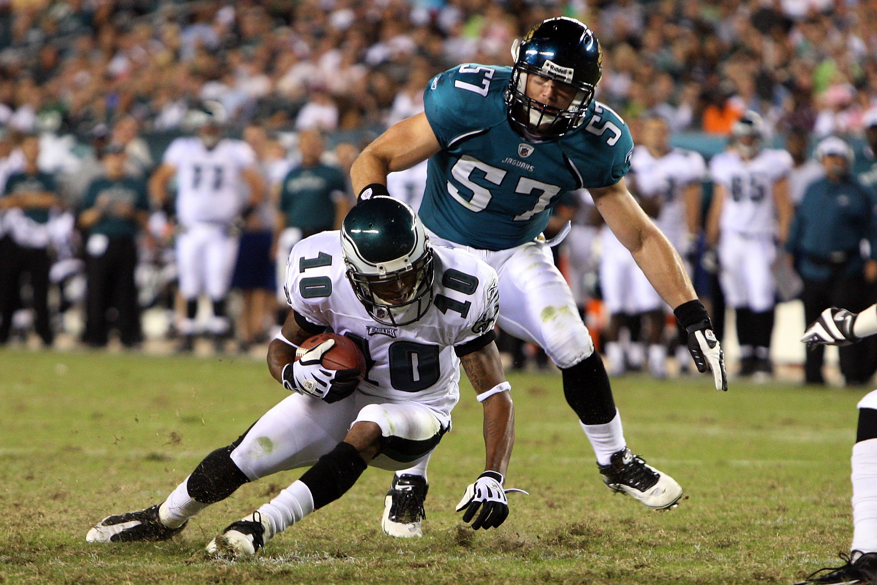 PHILADELPHIA - AUGUST 27:  DeSean Jackson #10 of the Philadelphia Eagles runs the ball against Tim Shaw #57 of the Jacksonville Jaguars in the preseason game at Lincoln Financial Field on August 27, 2009 in Philadelphia, Pennsylvania.  (Photo by Jim McIsa