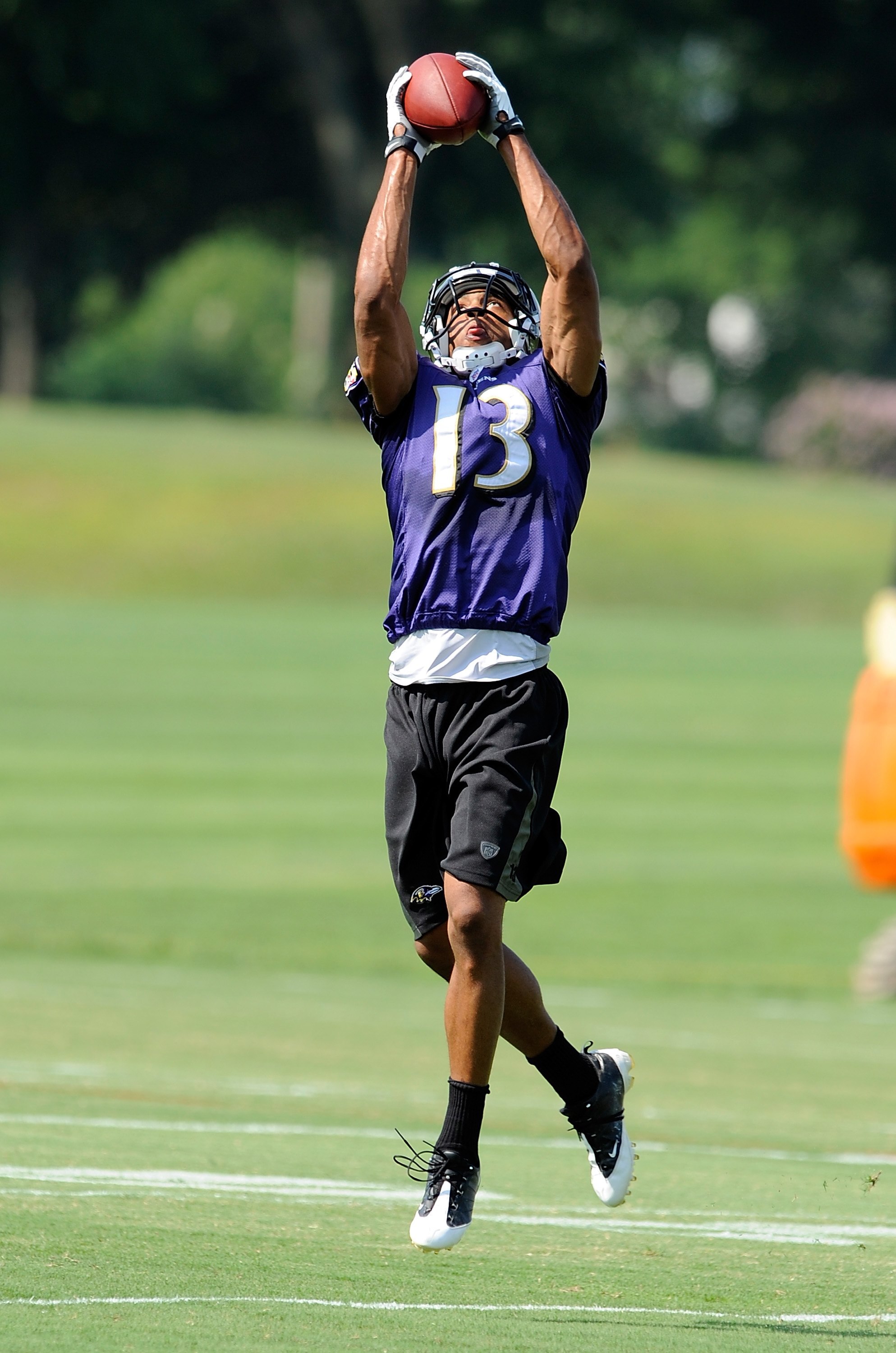 WESTMINSTER, MD - JULY 28:  Eron Riley #13 of the Baltimore Ravens catches a pass during training camp at McDaniel College on July 28, 2009 in Westminster, Maryland.  (Photo by Greg Fiume/Getty Images)