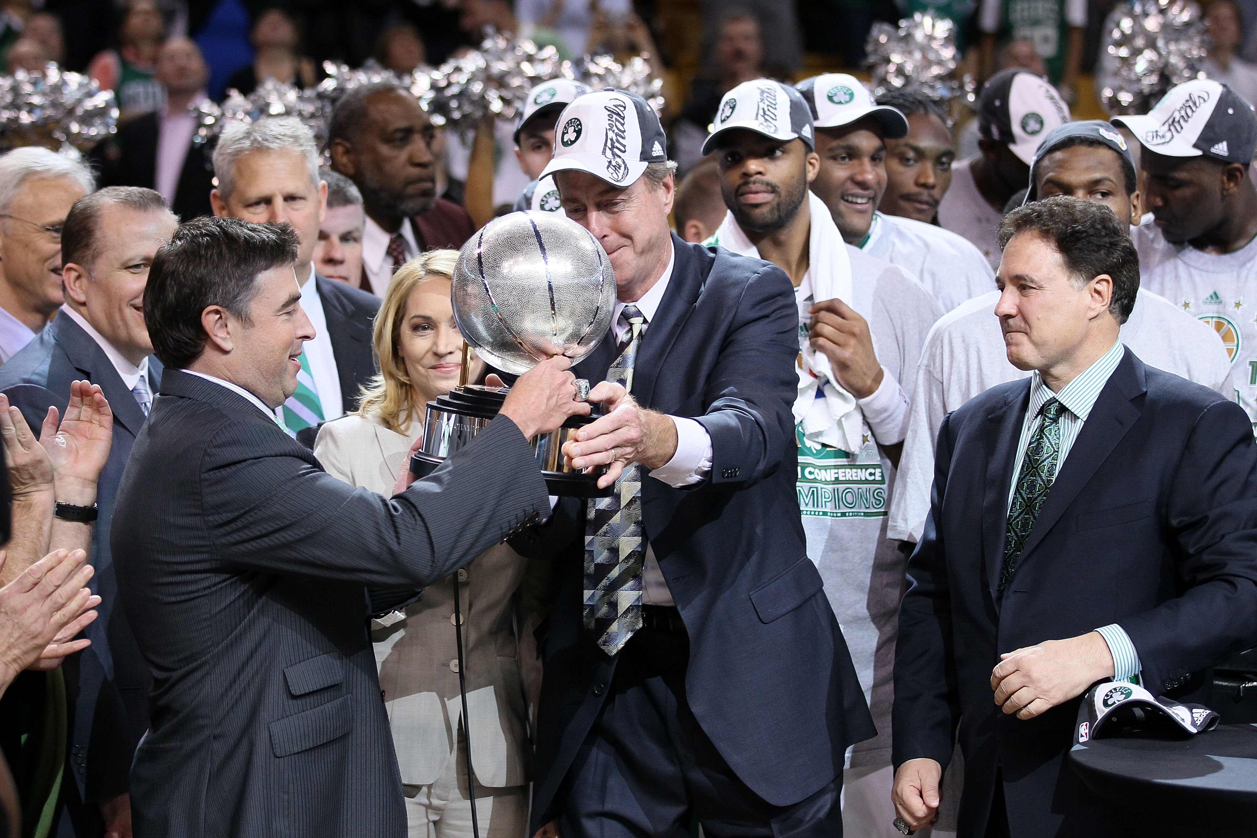 BOSTON - MAY 28:  Team owner Wyc Grousbeck of the Boston Celtics receives the Eastern Conference trophy from Dave Cowens after the Celtics won 96-84 against the Orlando Magic in Game Six of the Eastern Conference Finals during the 2010 NBA Playoffs at TD
