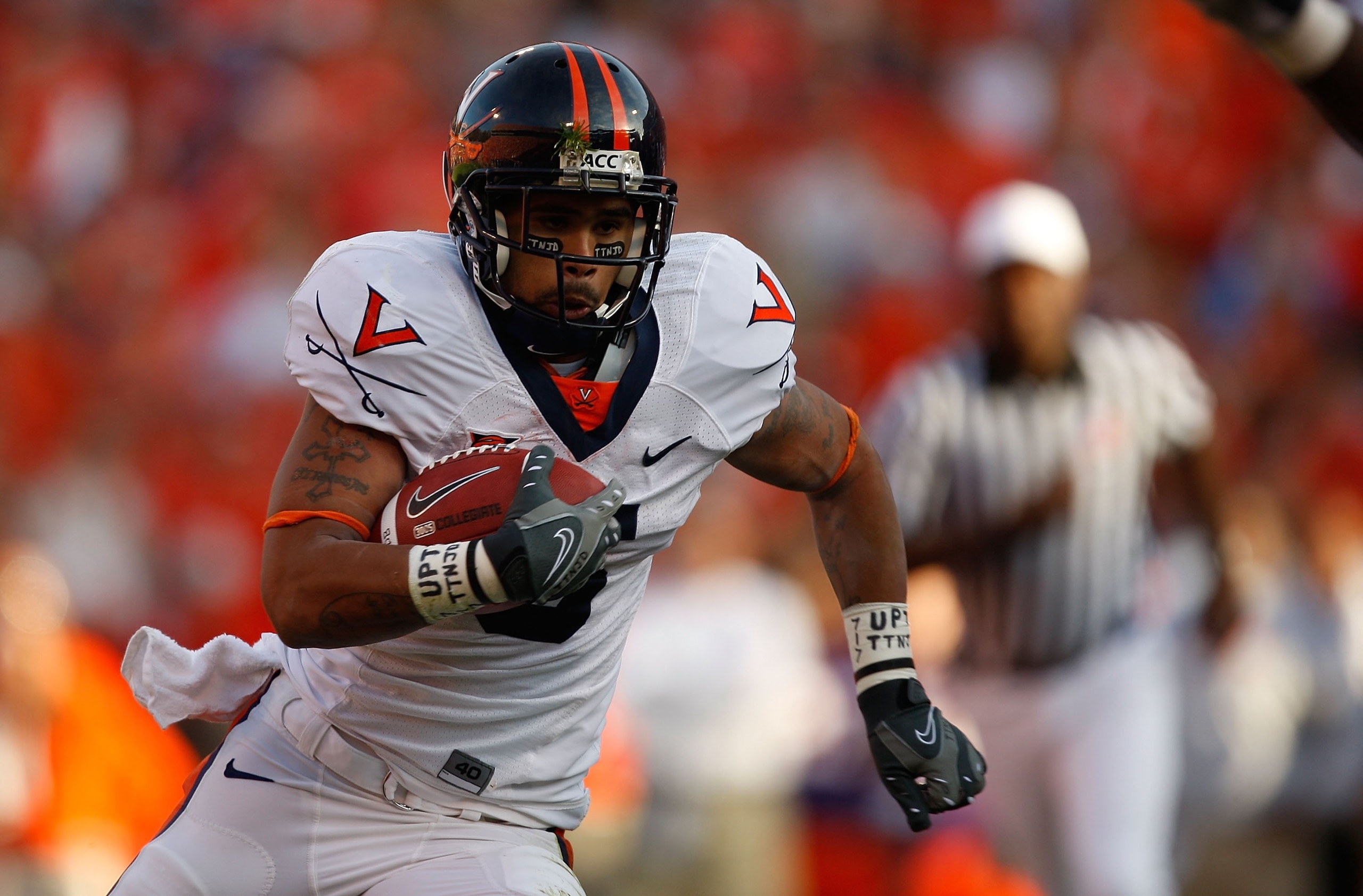 CLEMSON, SC - NOVEMBER 21:  Mikell Simpson #5 of the Virginia Cavaliers runs with the ball during the game against the Clemson Tigers at Memorial Stadium on November 21, 2009 in Clemson, South Carolina.  (Photo by Streeter Lecka/Getty Images)