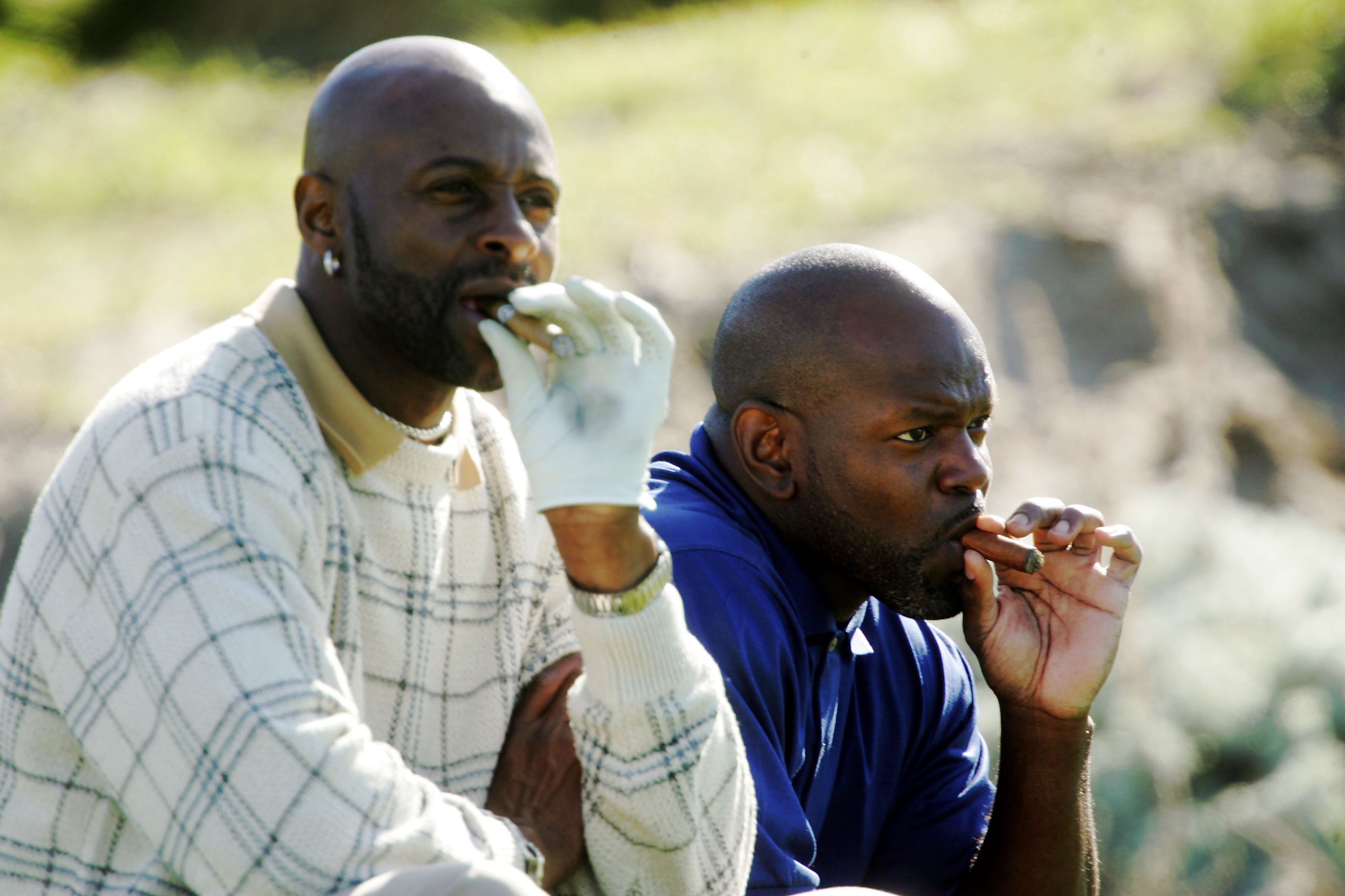 PEBBLE BEACH, CA - FEBRUARY 12:  Pro football greats Emmitt Smith (R) and Jerry Rice puff on cigars while they wait to tee of on the third hole during the third round of the AT&T Pebble Beach National Pro-Am on Spyglass Hill Golf Course on February 12, 20