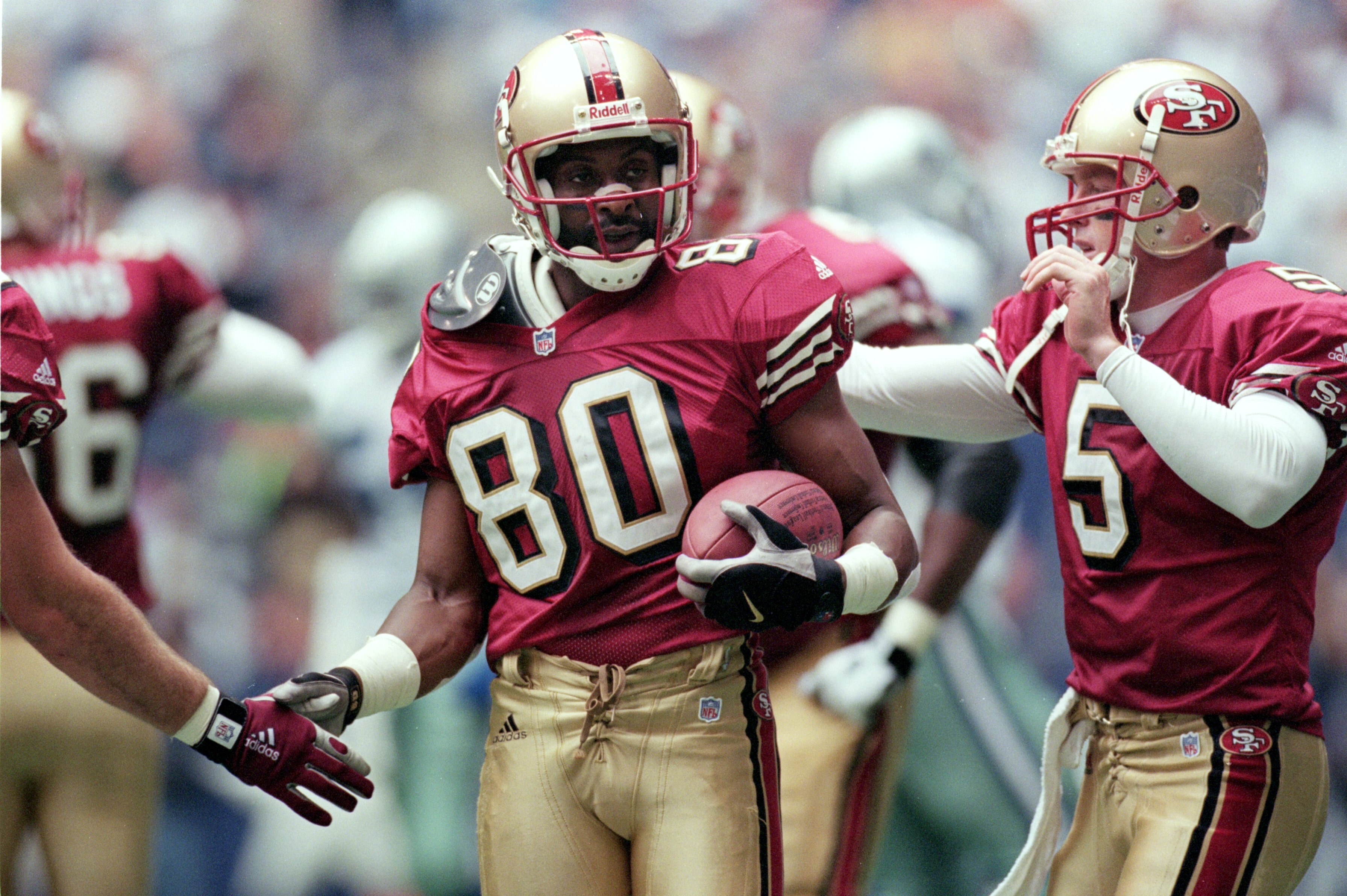 24 Sep 2000:  Jerry Rice #80 of the San Francisco 49ers get congradulated on his touchdown by teammate Jeff Garcia #5 during the game against the Dallas Cowboys at the Texas Stadium in Irving, Texas. The 49ers defeated the Cowboys 41-24.Mandatory Credit: 