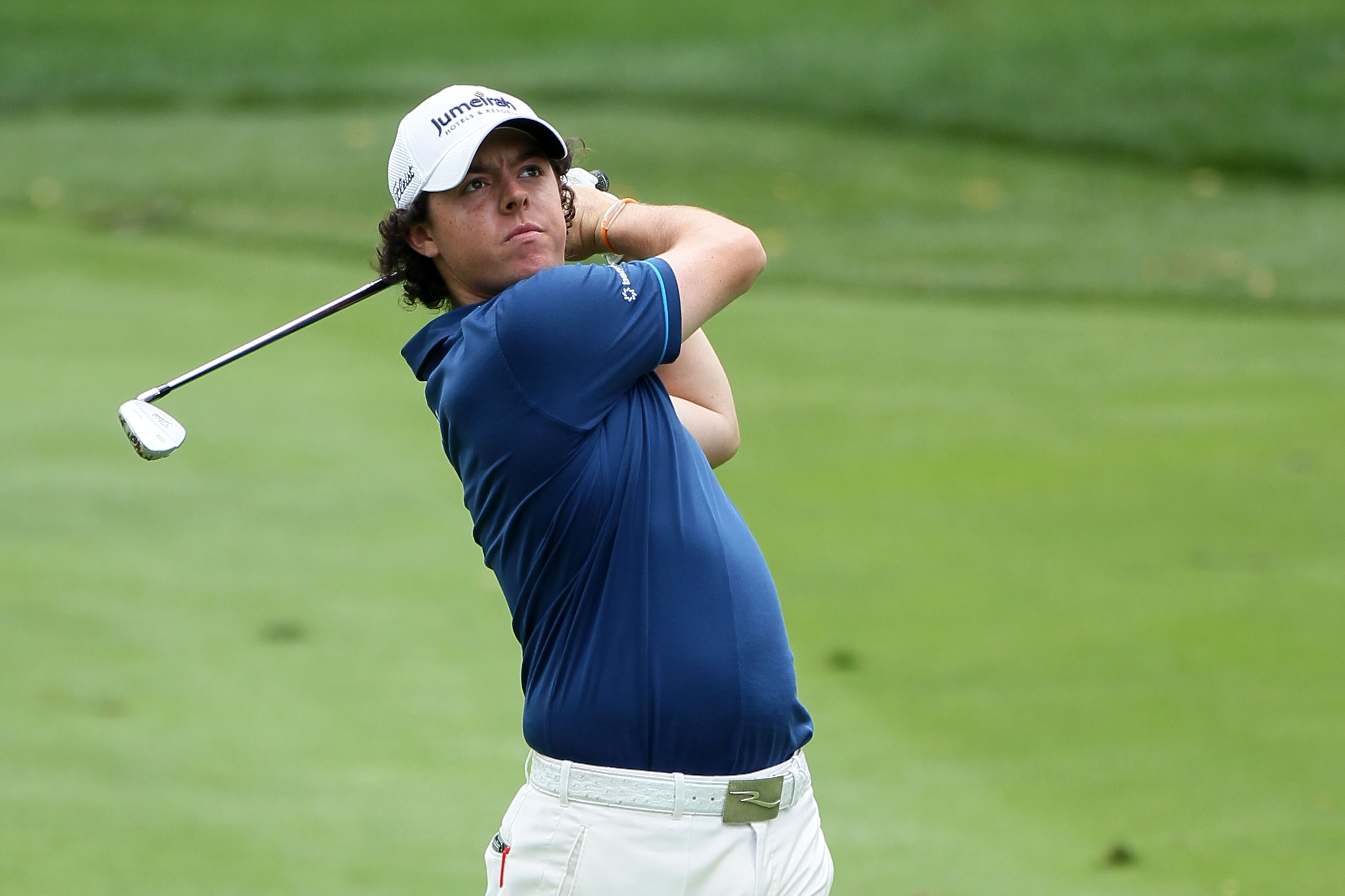 AKRON, OH - AUGUST 06:  Rory McIlroy of Northern Ireland plays an approach shot on the third hole during the second round of the World Golf Championships - Bridgestone Invitational on the South Course at Firestone Country Club on August 6, 2010 in Akron,