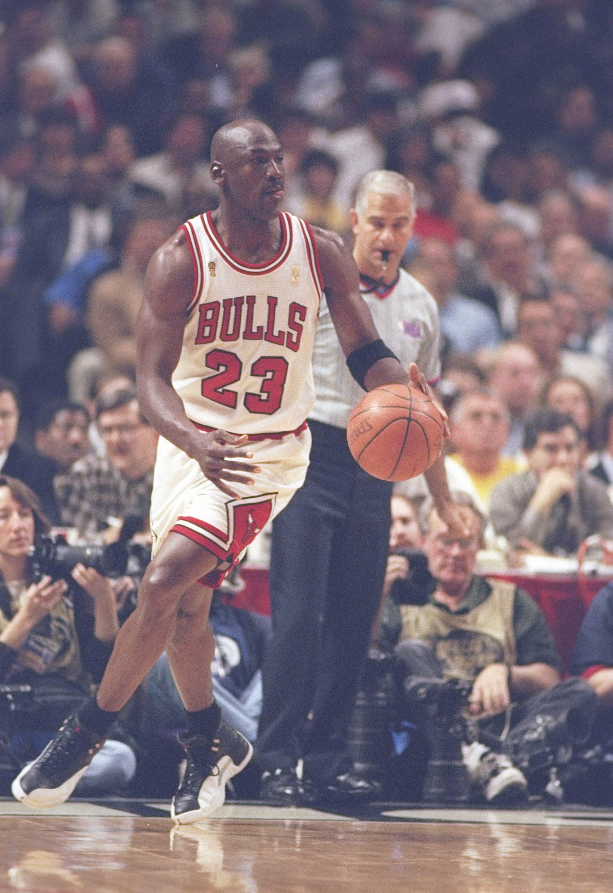 4 Jun 1997: Guard Michael Jordan of the Chicago Bulls dribbles down the court during a playoff game against the Utah Jazz at the United Center in Chicago, Illinois. The Bulls won the game 97-85.