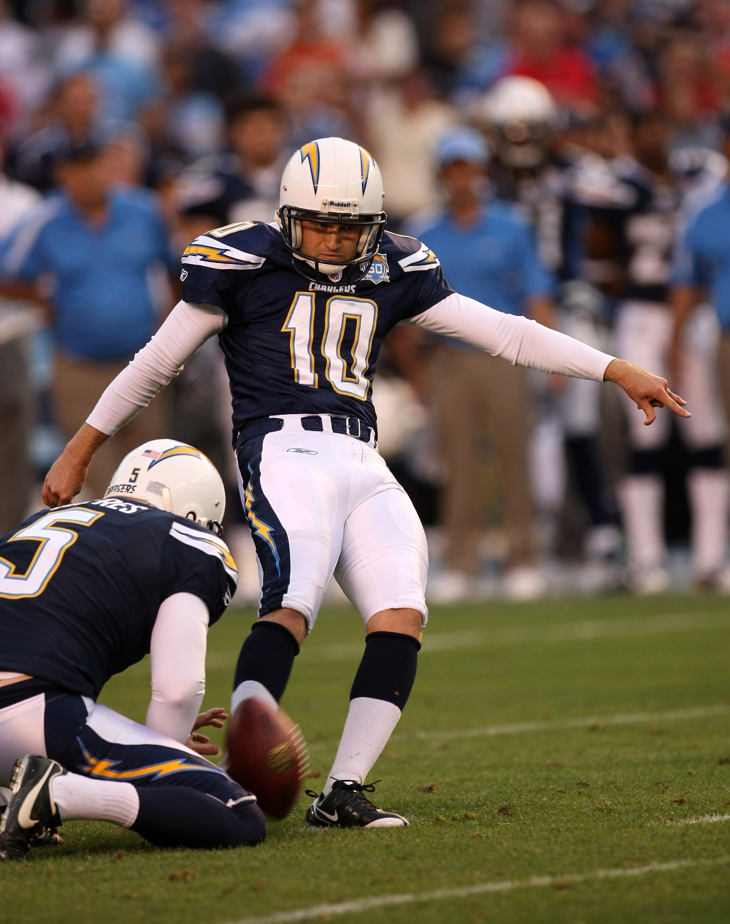 SAN DIEGO - DECEMBER 20:  Nate Kaeding #10 of the San Diego Chargers kicks the game winning field goal with three seconds left in the game against the Cincinnati Bengals as Mike Scifres holds on December 20, 2009 at Qualcomm Stadium in San Diego, Californ