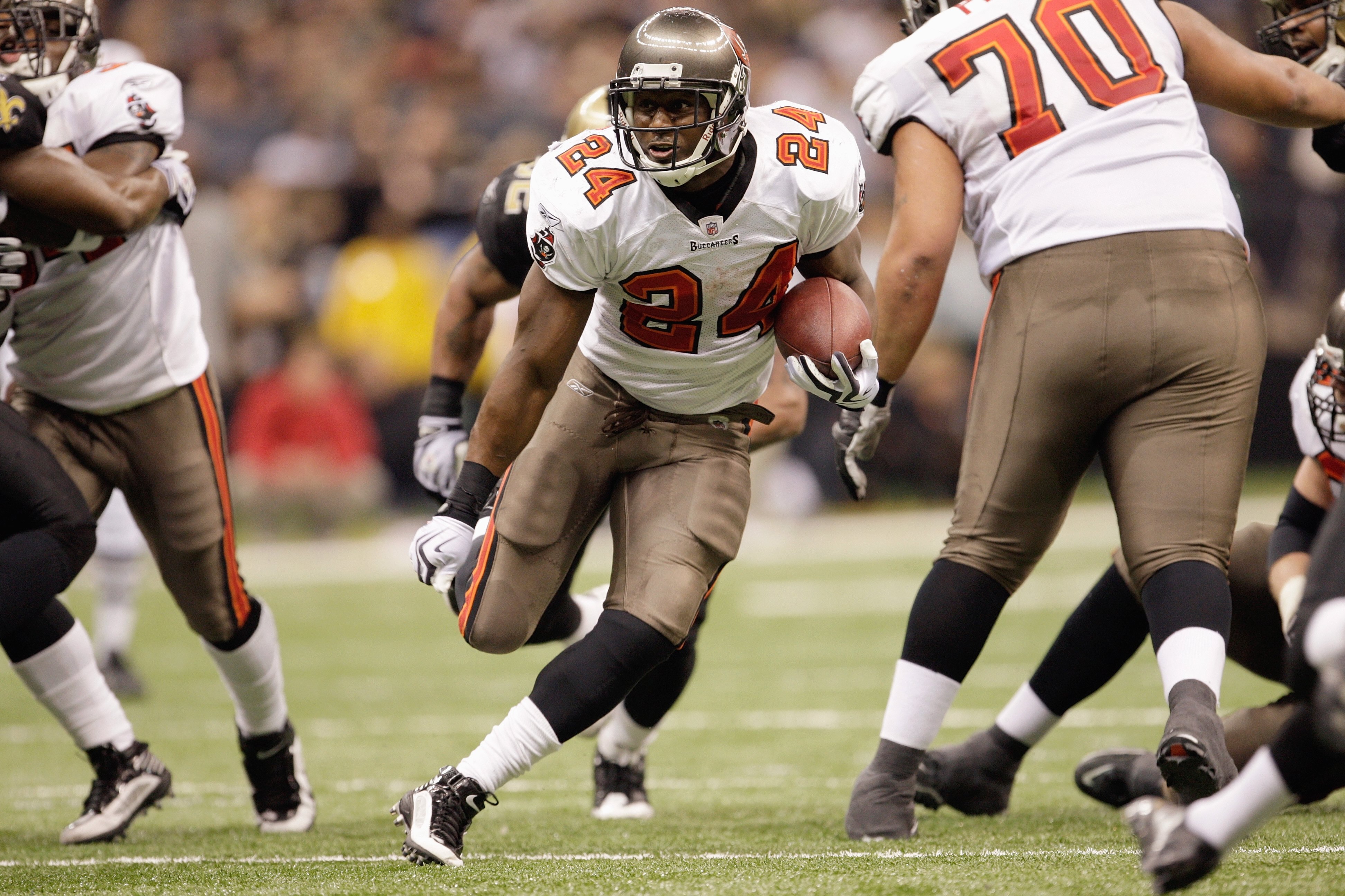 NEW ORLEANS - DECEMBER 27:  Carnell Williams #24 of the Tampa Bay Buccaneers runs the ball up the middle during the game against the New Orleans Saints at the Louisiana Superdome on December 27, 2009 in New Orleans, Louisiana. (Photo by Jamie Squire/Getty