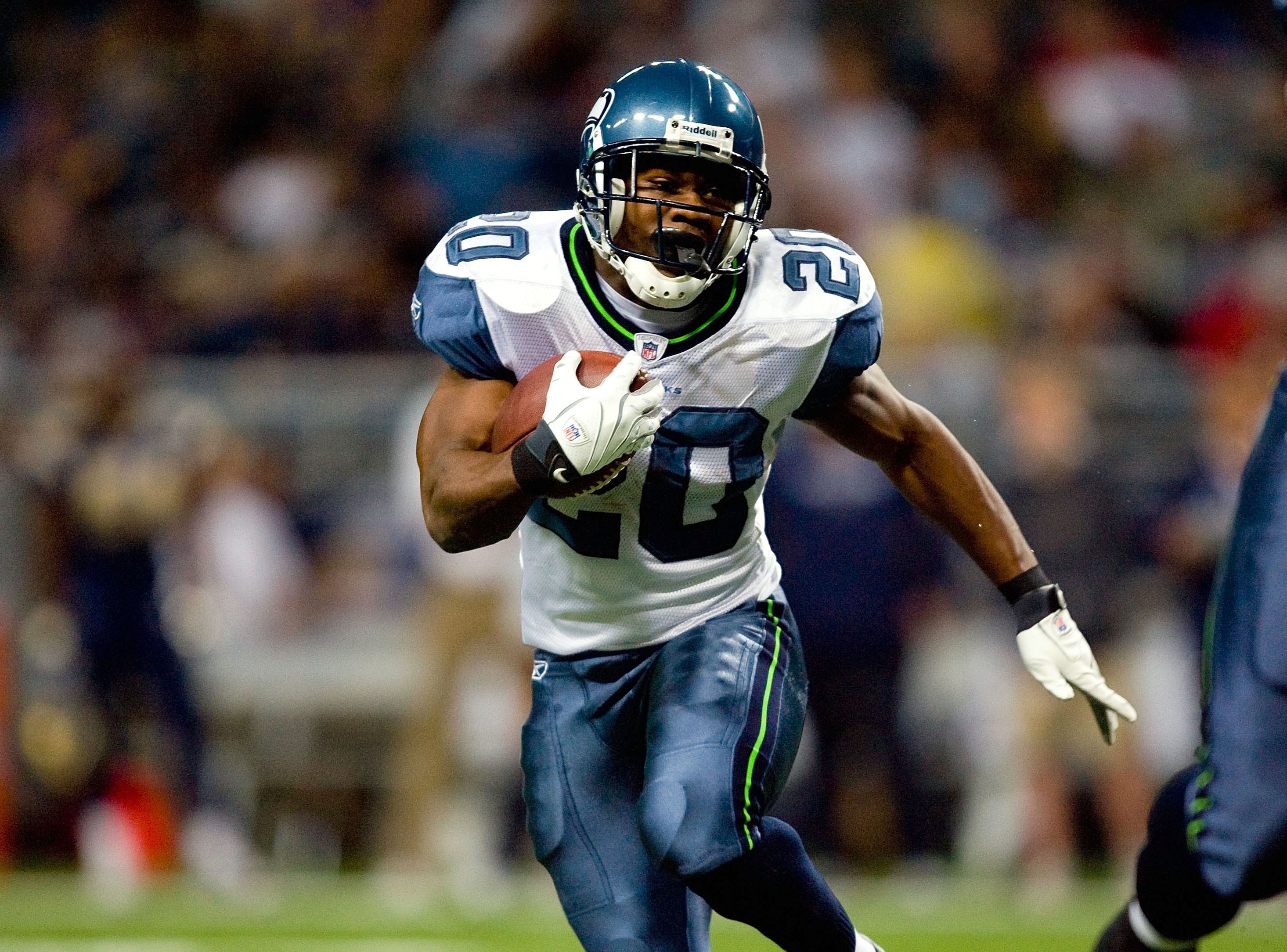 ST. LOUIS - NOVEMBER 29:  Justin Forsett #20 of the Seattle Seahawks runs with the ball for yardage against the St. Louis Rams during their NFL game at Edward Jones Dome on November 29, 2009 in St. Louis, Missouri. The Seahawks defeated the Rams 27-17.  (