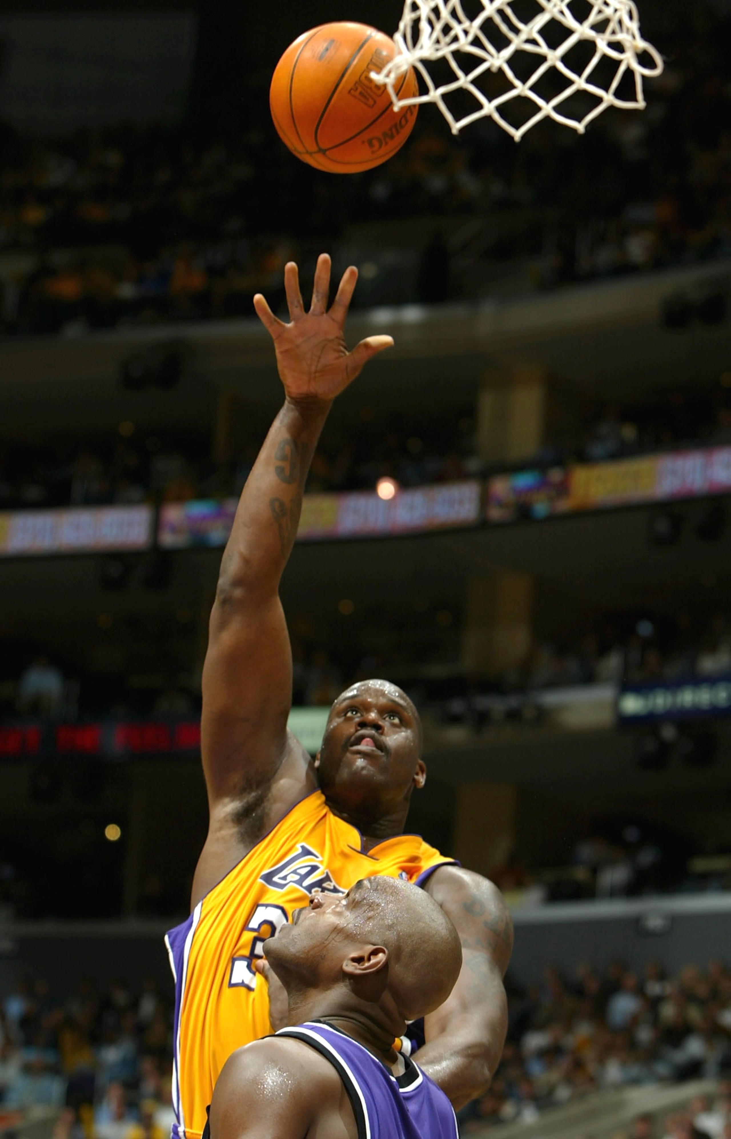 LOS ANGELES - MARCH 24: Shaquille O'Neal #34 of the Los Angeles Lakers puts a shot up over Chris Webber #4 of the Sacramento Kings during the game at Staples Center on March 24, 2004 in Los Angeles, California. NOTE TO USER: User expressly acknowledges LOS ANGELES - MARCH 24: Shaquille O'Neal #34 of the Los Angeles Lakers puts a shot up over Chris Webber #4 of the Sacramento Kings during the game at Staples Center on March 24, 2004 in Los Angeles, California. NOTE TO USER: User expressly acknowledges