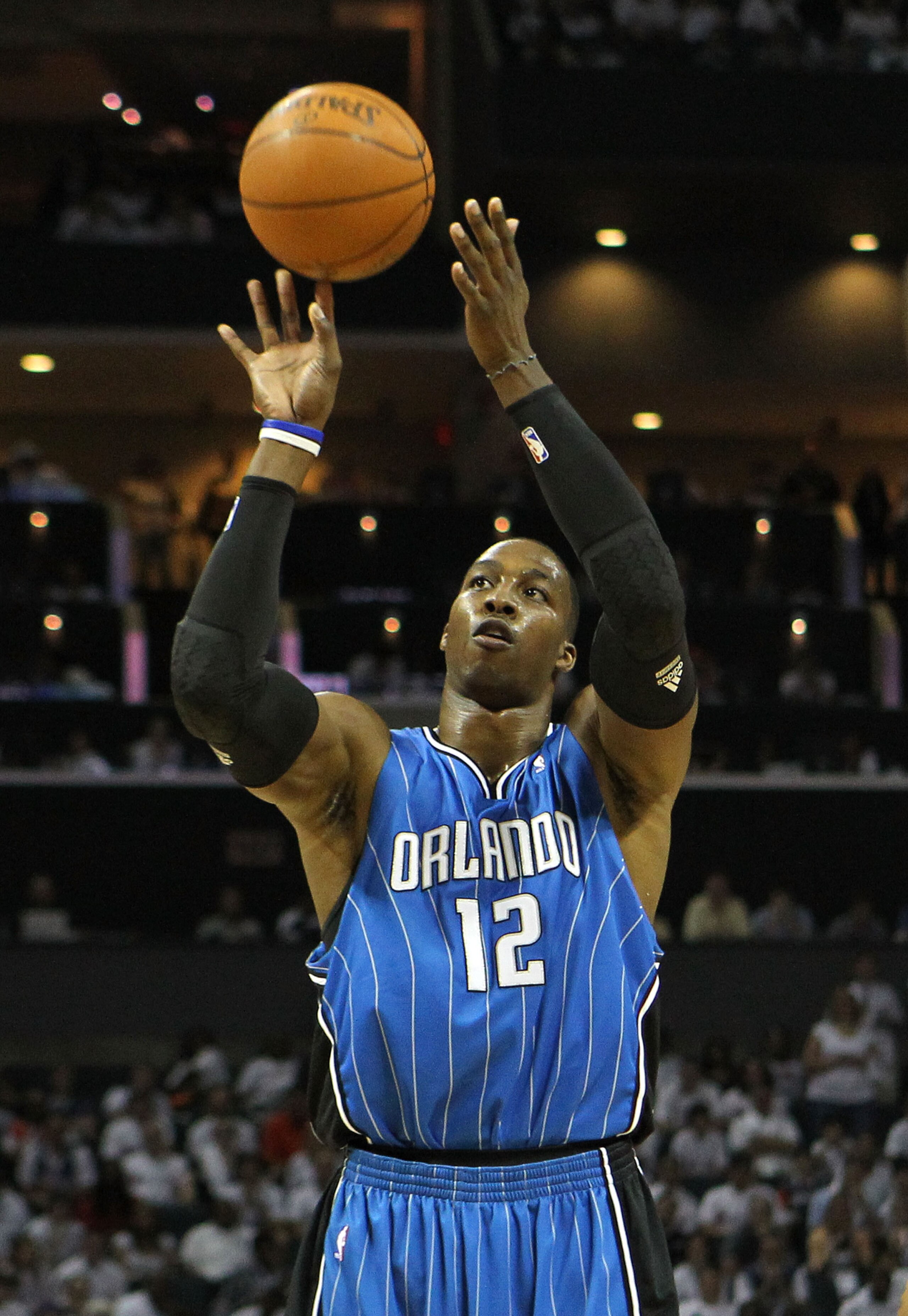 CHARLOTTE, NC - APRIL 24:  Center Dwight Howard #12 of the Orlando Magic shoots a free throw during Game Three of the Eastern Conference Quarterfinals during the 2010 NBA Playoffs at Time Warner Cable Arena on April 24, 2010 in Charlotte, North Carolina. 
