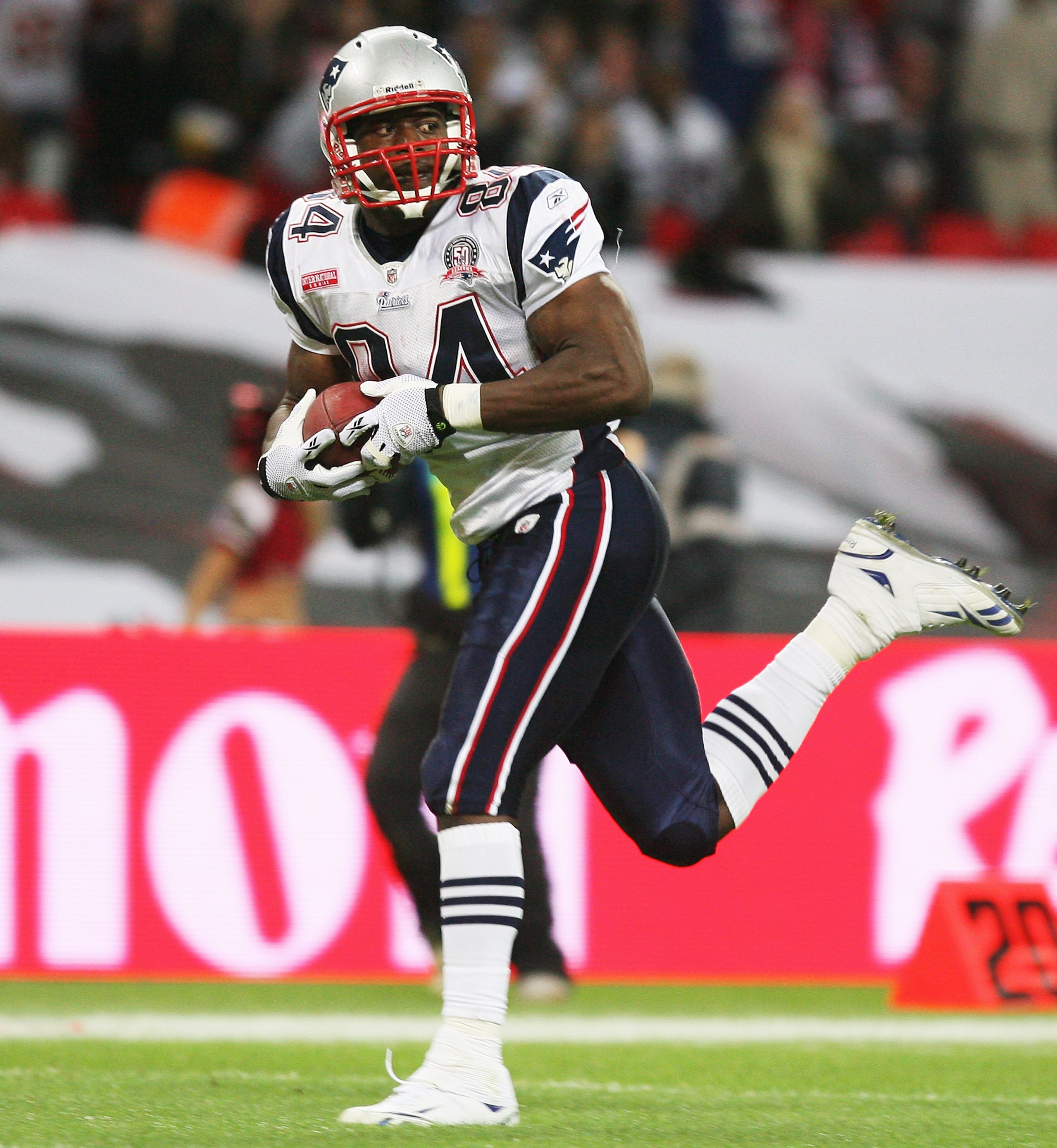 LONDON, ENGLAND - OCTOBER 25:  Benjamin Watson (#84) of the New England Patriots runs with the ball  during the NFL International Series match between New England Patriots and Tampa Bay Buccaneers at Wembley Stadium on October 25, 2009 in London, England.