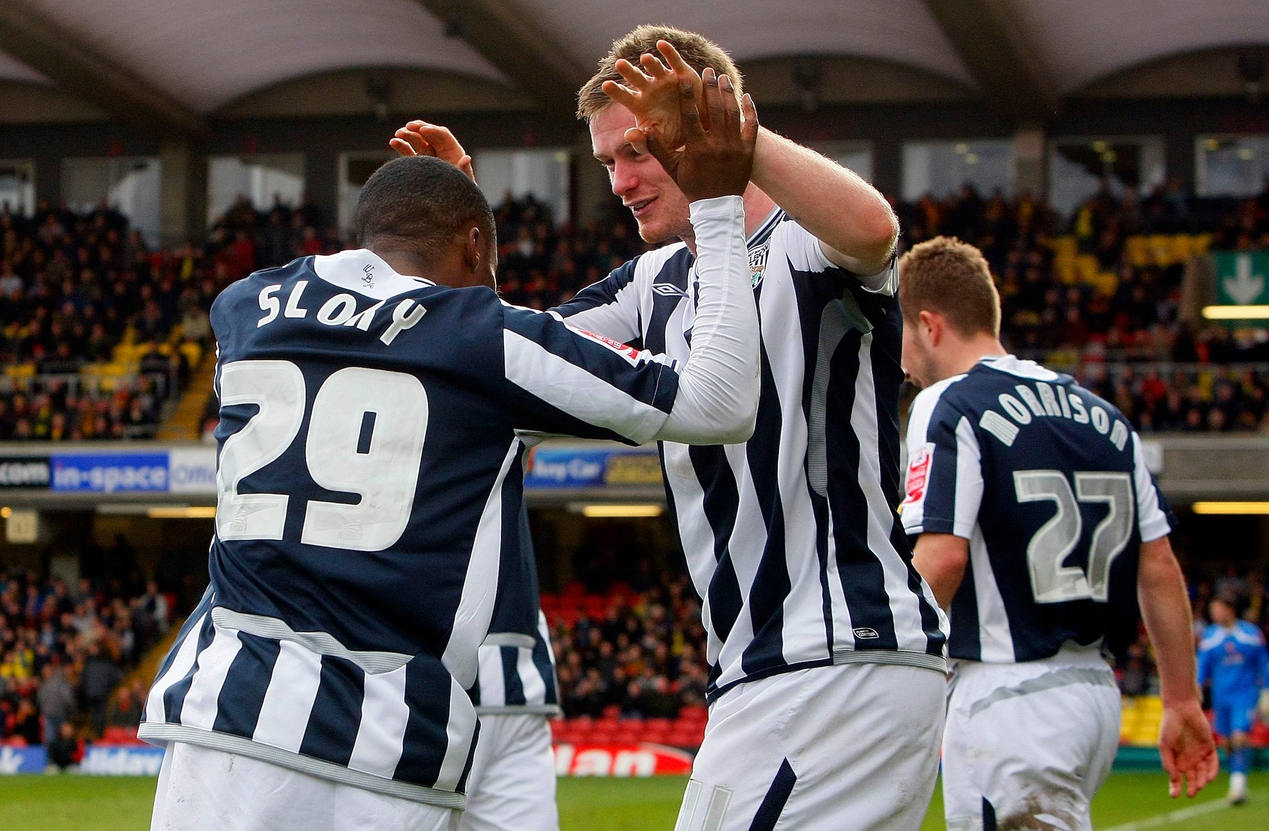 WATFORD, ENGLAND - APRIL 05: Goalscorer Chris Brunt (R) and Andwele Slory (L) of West Bromwich Albion celebrate the equalising goal during the Coca Cola Championship match between Watford and West Bromwich Albion at Vicarage Road on April 05, 2010 in Watf