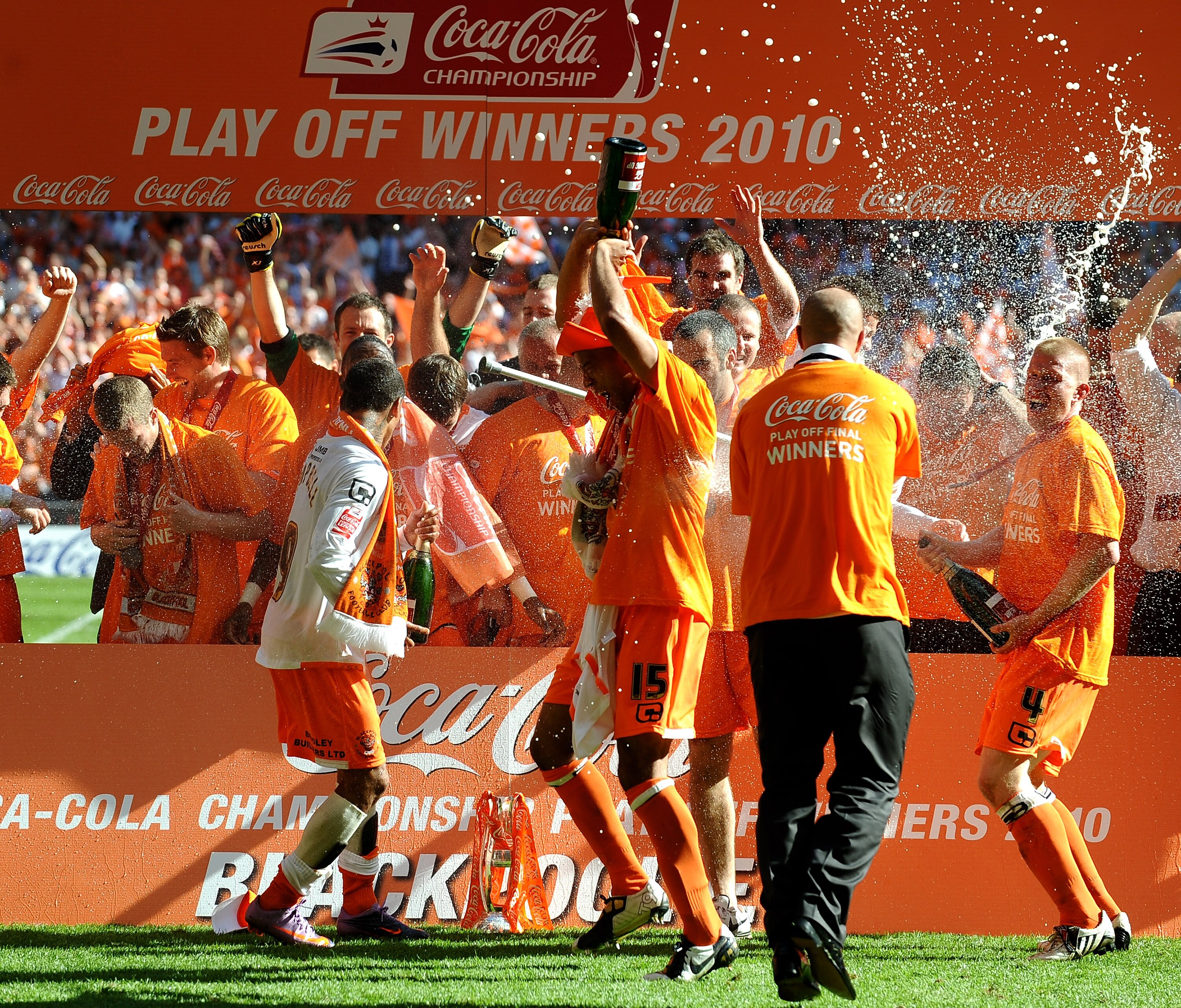 LONDON, ENGLAND - MAY 22:  The Blackpool Team celebrate promotion to the Premier League after victory in the Coca-Cola Championship Playoff Final between Blackpool and Cardiff City at Wembley Stadium on May 22, 2010 in London, England.  (Photo by Laurence