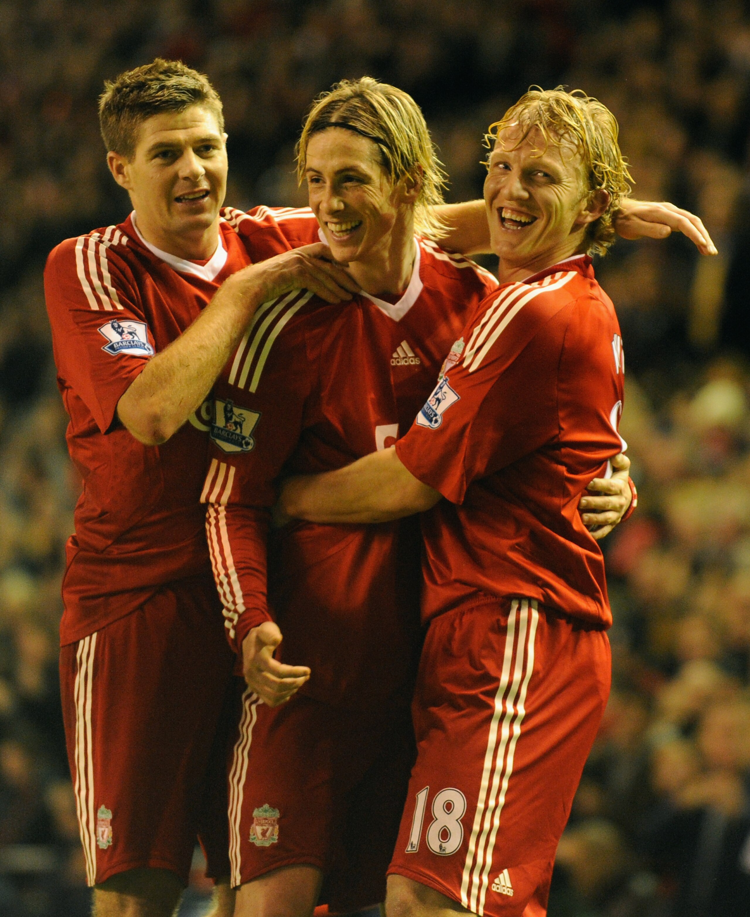 LIVERPOOL, ENGLAND - DECEMBER 13:  Dirk Kuyt (R) of Liverpool celebrates scoring the opening goal with team mates Steven Gerrard (L) and Fernando Torres during the Barclays Premier League match between Liverpool and Arsenal at Anfield on December 13, 2009