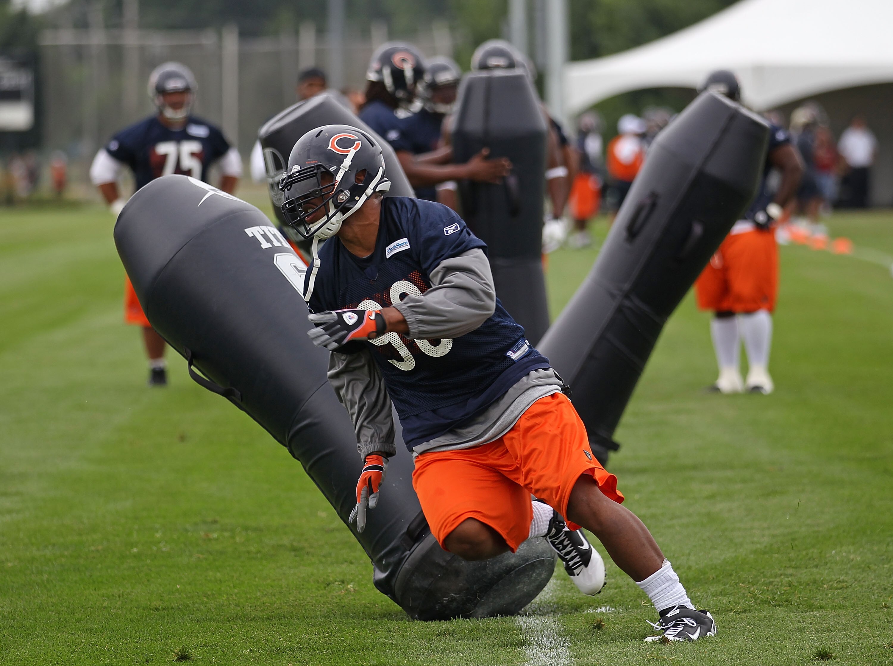 BOURBONNAIS, IL - JULY 30: Julius Peppers #90 of the Chicago Bears works out during a summer training camp practice at Olivet Nazarene University on July 30, 2010 in Bourbonnais, Illinois. (Photo by Jonathan Daniel/Getty Images)