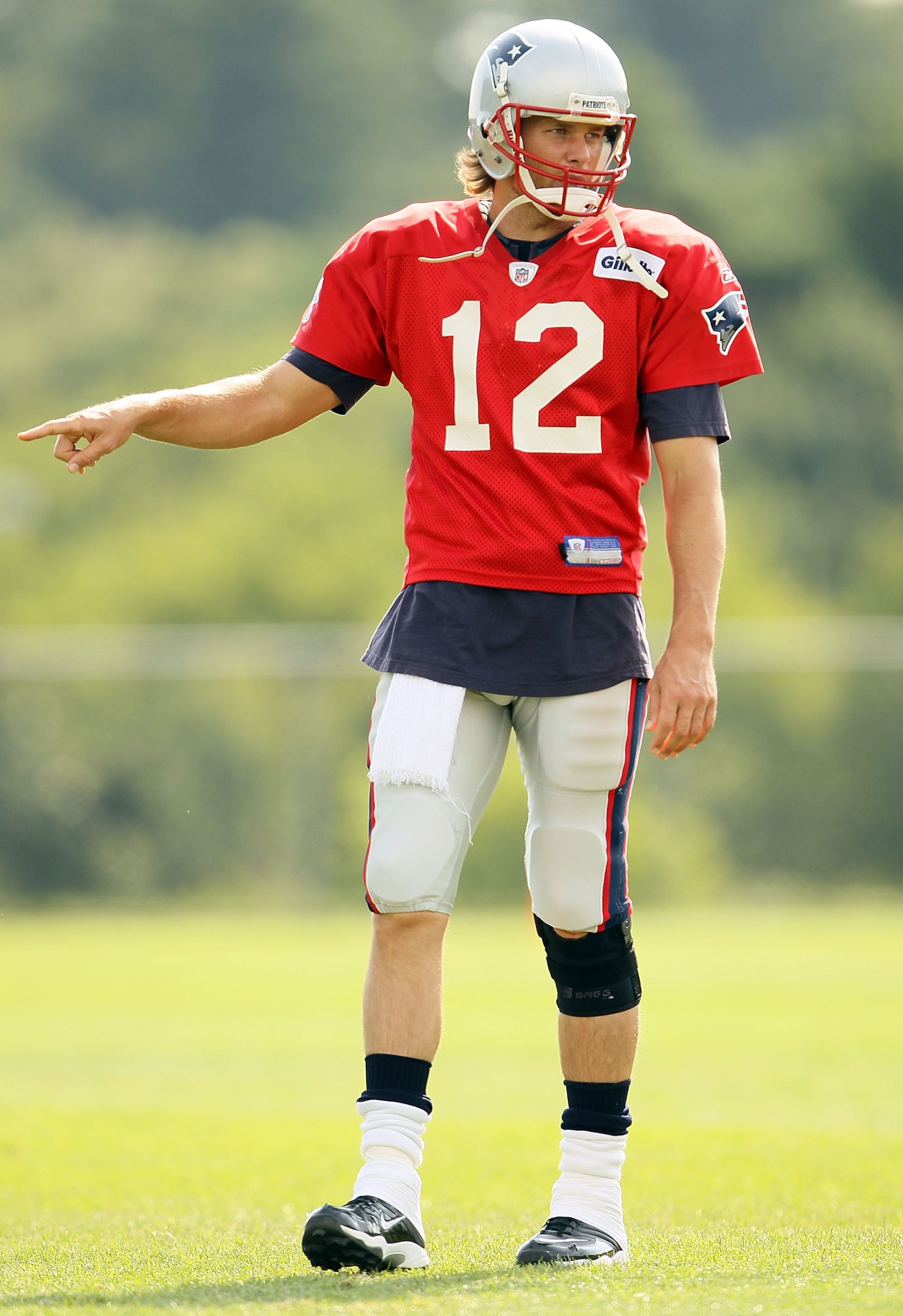 FOXBORO, MA - AUGUST 02:  Quarterback Tom Brady #12 of the New England Patriots directs his teammates during training camp on August 2, 2010 at Gillette Stadium in Foxboro, Massachusetts.  (Photo by Elsa/Getty Images)