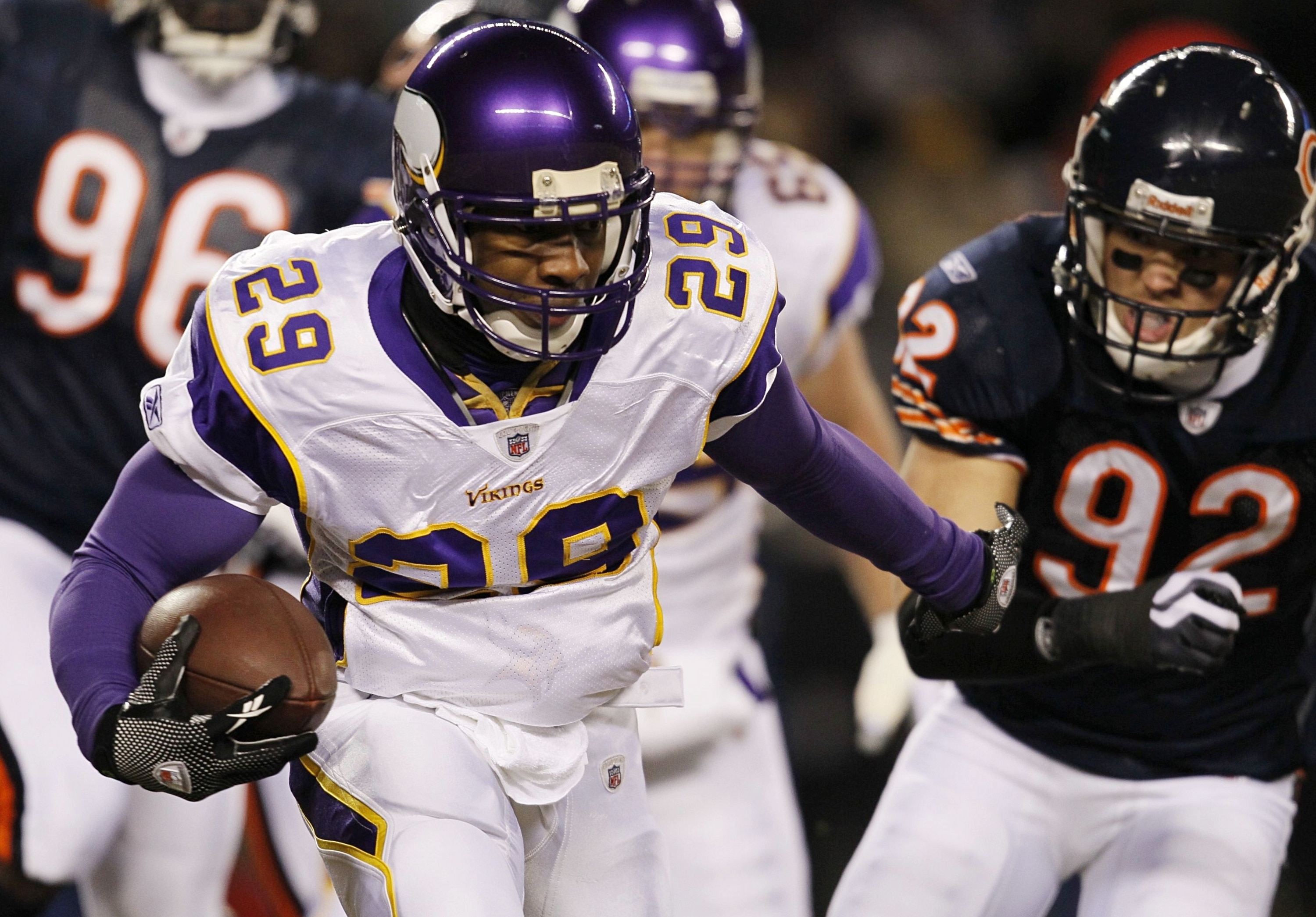 CHICAGO - DECEMBER 28:  Chester Taylor #29 of the Minnesota Vikings runs the ball in the first quarter against Hunter Hillenmeyer #92 of the Chicago Bears at Soldier Field on December 28, 2009 in Chicago, Illinois. (Photo by Jonathan Daniel/Getty Images)