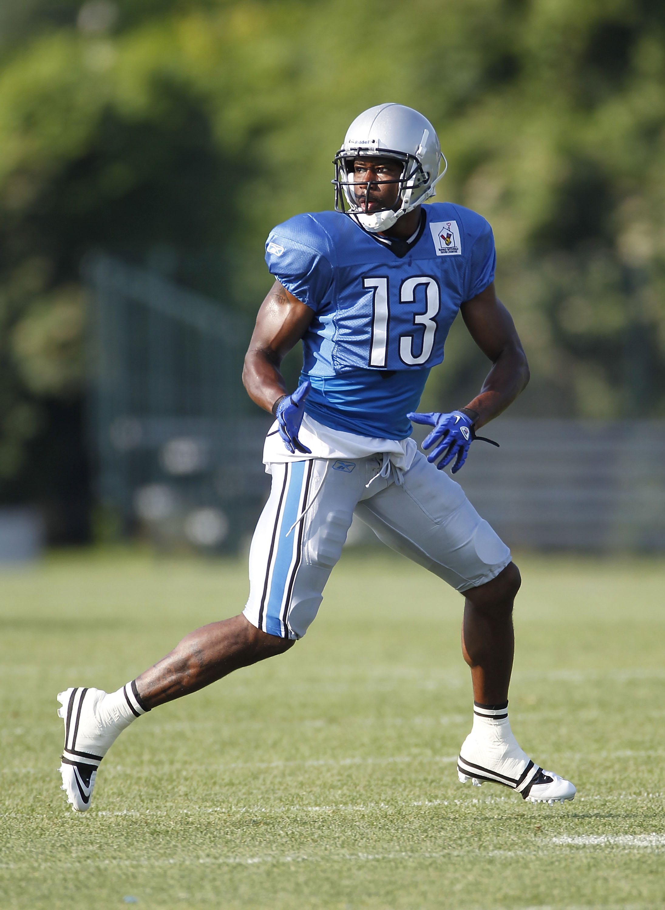 ALLEN PARK, MI - AUGUST 05:  Nate Burleson #13 of the Detroit Lions gets ready to catch a pass during training camp at the Detroit Lions Headquarters and Training Facility on August 5, 2010 in Allen Park, Michigan.  (Photo by Gregory Shamus/Getty Images)