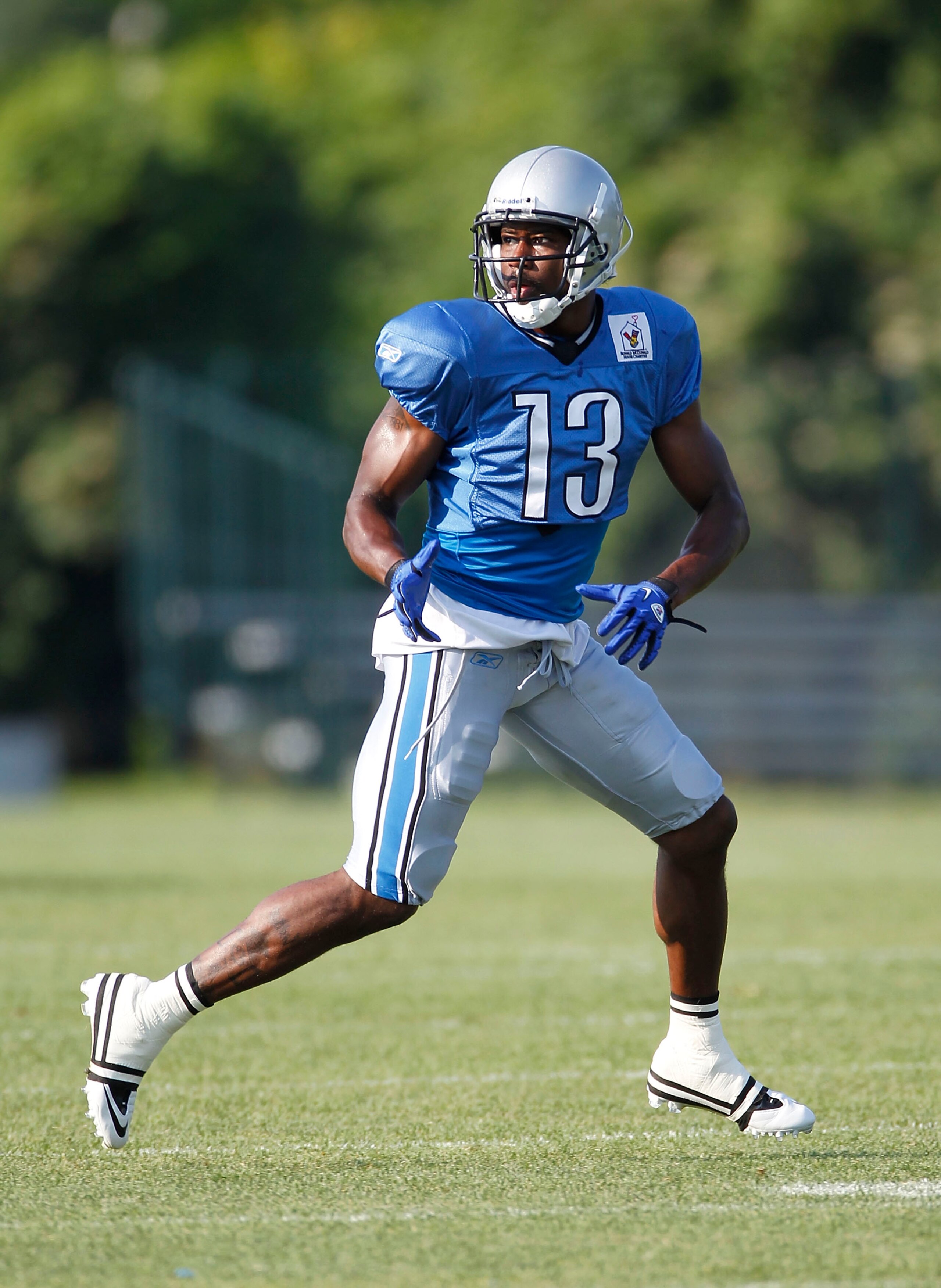 ALLEN PARK, MI - AUGUST 05:  Nate Burleson #13 of the Detroit Lions gets ready to catch a pass during training camp at the Detroit Lions Headquarters and Training Facility on August 5, 2010 in Allen Park, Michigan.  (Photo by Gregory Shamus/Getty Images)