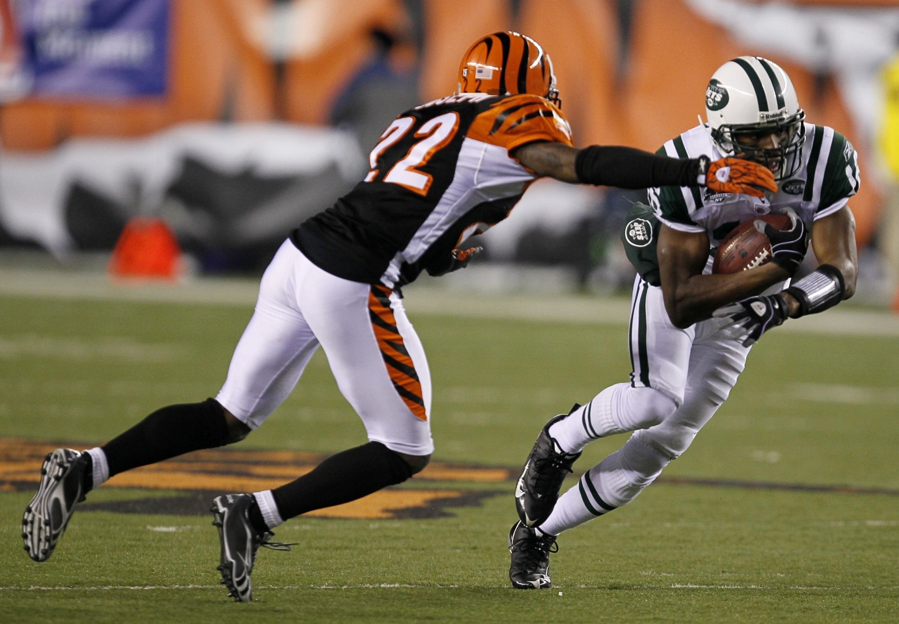 CINCINNATI - JANUARY 9:  Brad Smith #16 of the New York Jets runs the ball against Johnathan Joseph #22 of the Cincinnati Bengals during the 2010 AFC wild-card playoff game at Paul Brown Stadium on January 9, 2010 in Cincinnati, Ohio. (Photo by Jonathan D