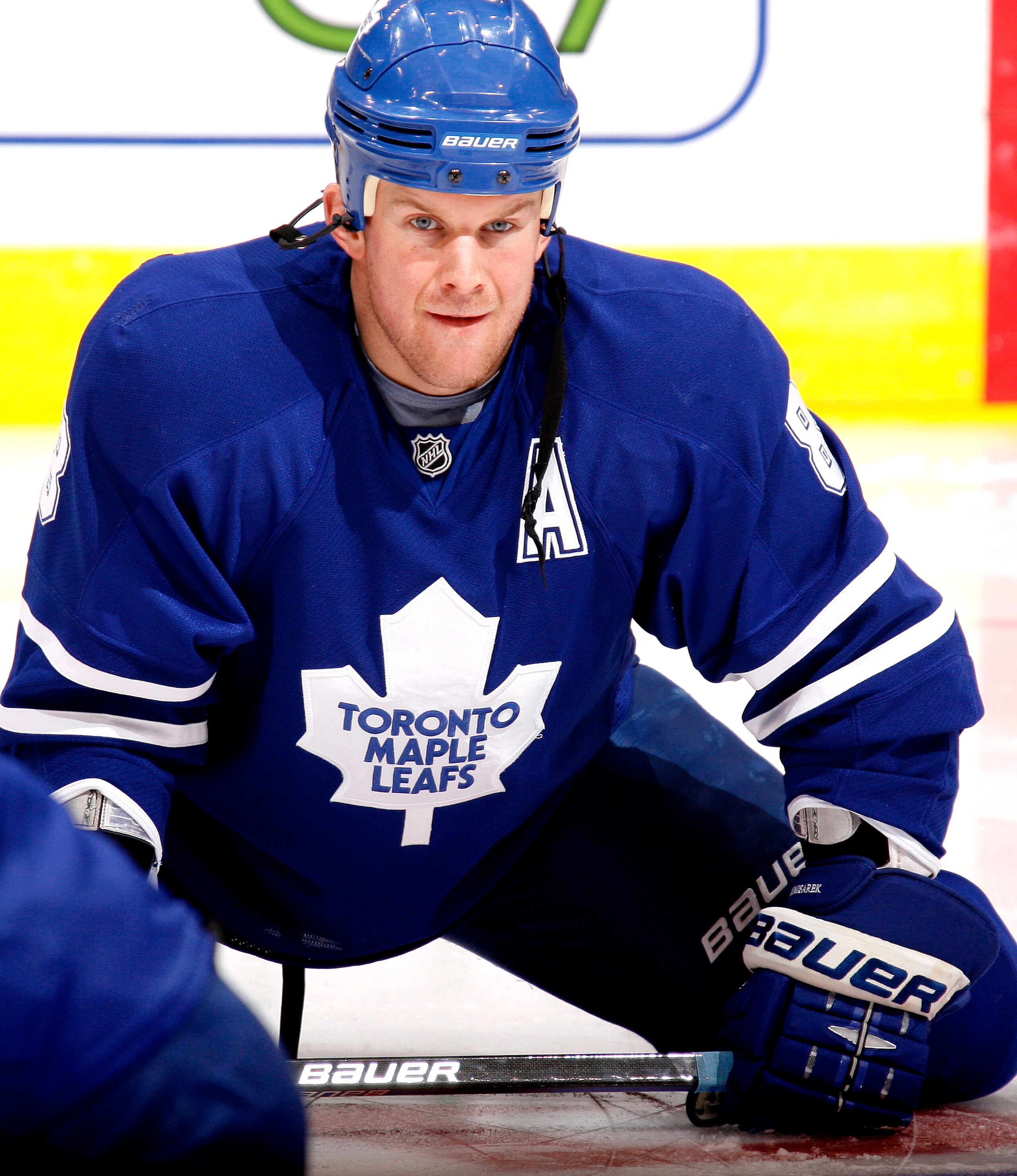 TORONTO - NOVEMBER 30: Mike Komisarek #8 of the Toronto Maple Leafs stretches during warmup before playing the Buffalo Sabres November 30, 2009 at the Air Canada Centre in Toronto, Ontario, Canada. (Photo by Abelimages / Getty Images) TORONTO - NOVEMBER 30: Mike Komisarek #8 of the Toronto Maple Leafs stretches during warmup before playing the Buffalo Sabres November 30, 2009 at the Air Canada Centre in Toronto, Ontario, Canada. (Photo by Abelimages / Getty Images)