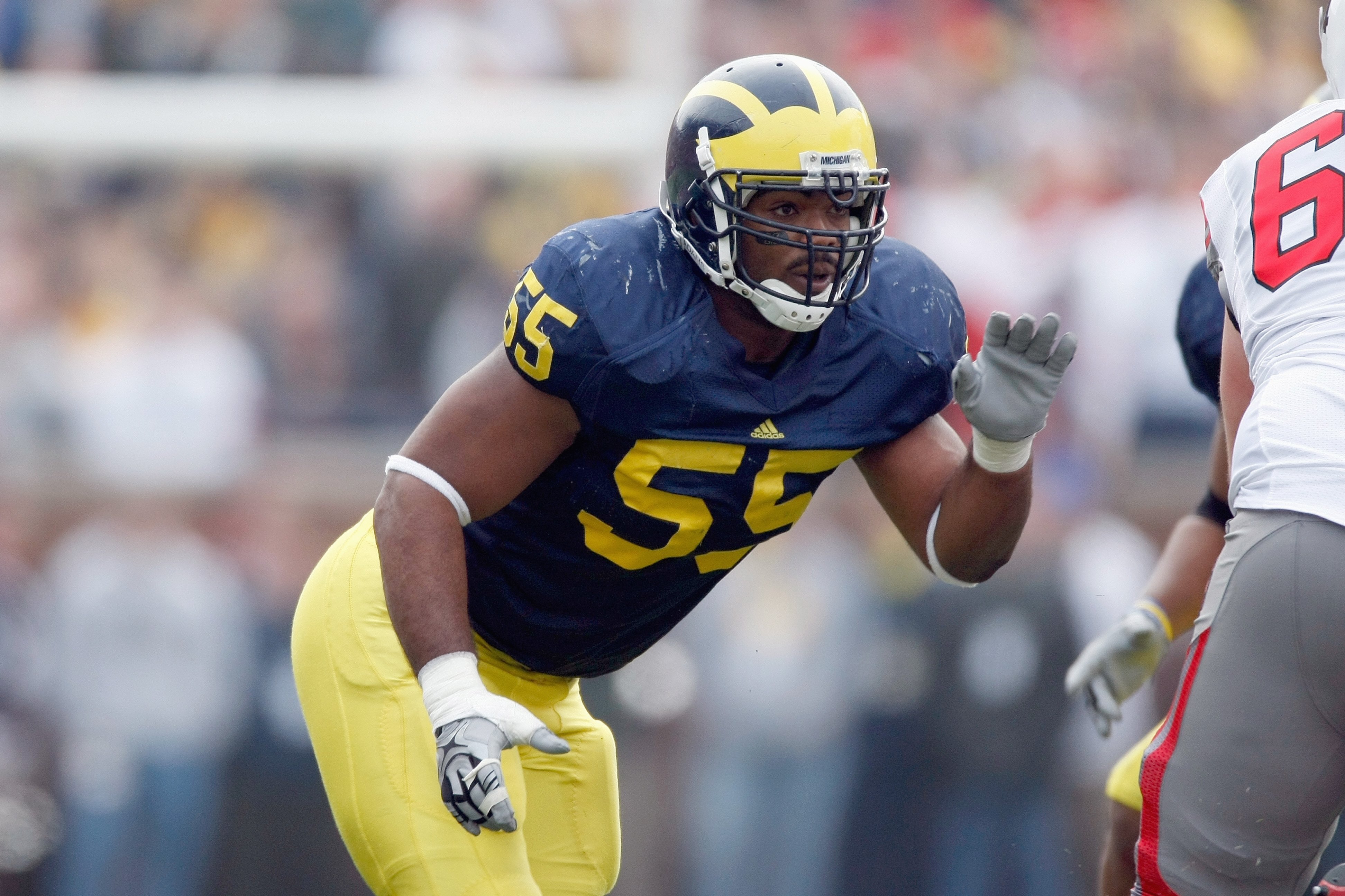 ANN ARBOR, MI - NOVEMBER 21:  Brandon Graham #55 of the Michigan Wolverines moves off the line of scrimmage during the game against the Ohio State Buckeyes on November 21, 2009 at Michigan Stadium in Ann Arbor, Michigan. Ohio State won the game 21-10. (Ph