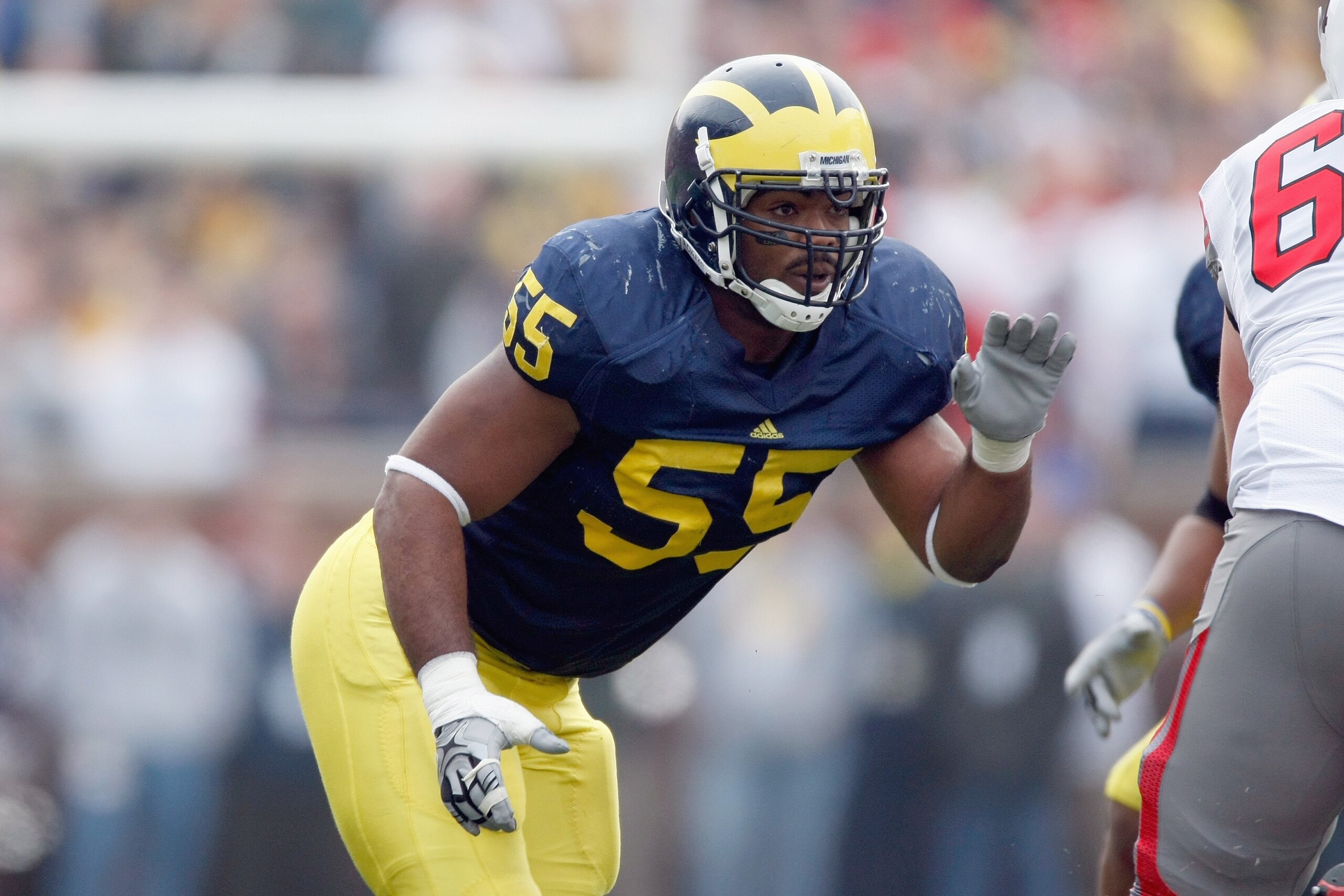 ANN ARBOR, MI - NOVEMBER 21:  Brandon Graham #55 of the Michigan Wolverines moves off the line of scrimmage during the game against the Ohio State Buckeyes on November 21, 2009 at Michigan Stadium in Ann Arbor, Michigan. Ohio State won the game 21-10. (Ph