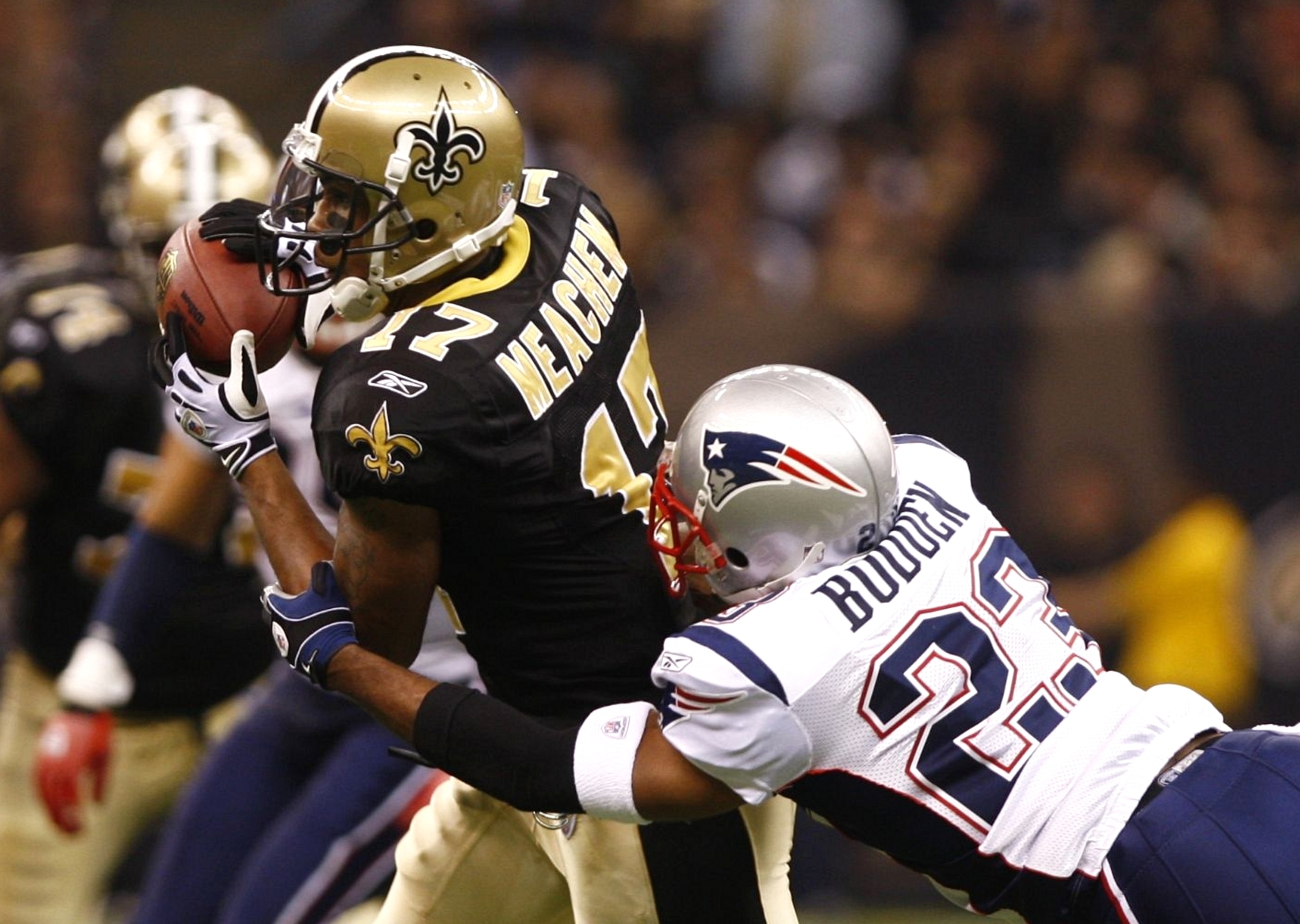 NEW ORLEANS - NOVEMBER 30: Robert Meachem #17 of the New Orleans Saints makes a reception against Leigh Bodden #23 of the New England Patriots at Louisana Superdome on November 30, 2009 in New Orleans, Louisiana. (Photo by Scott Halleran/Getty Images)