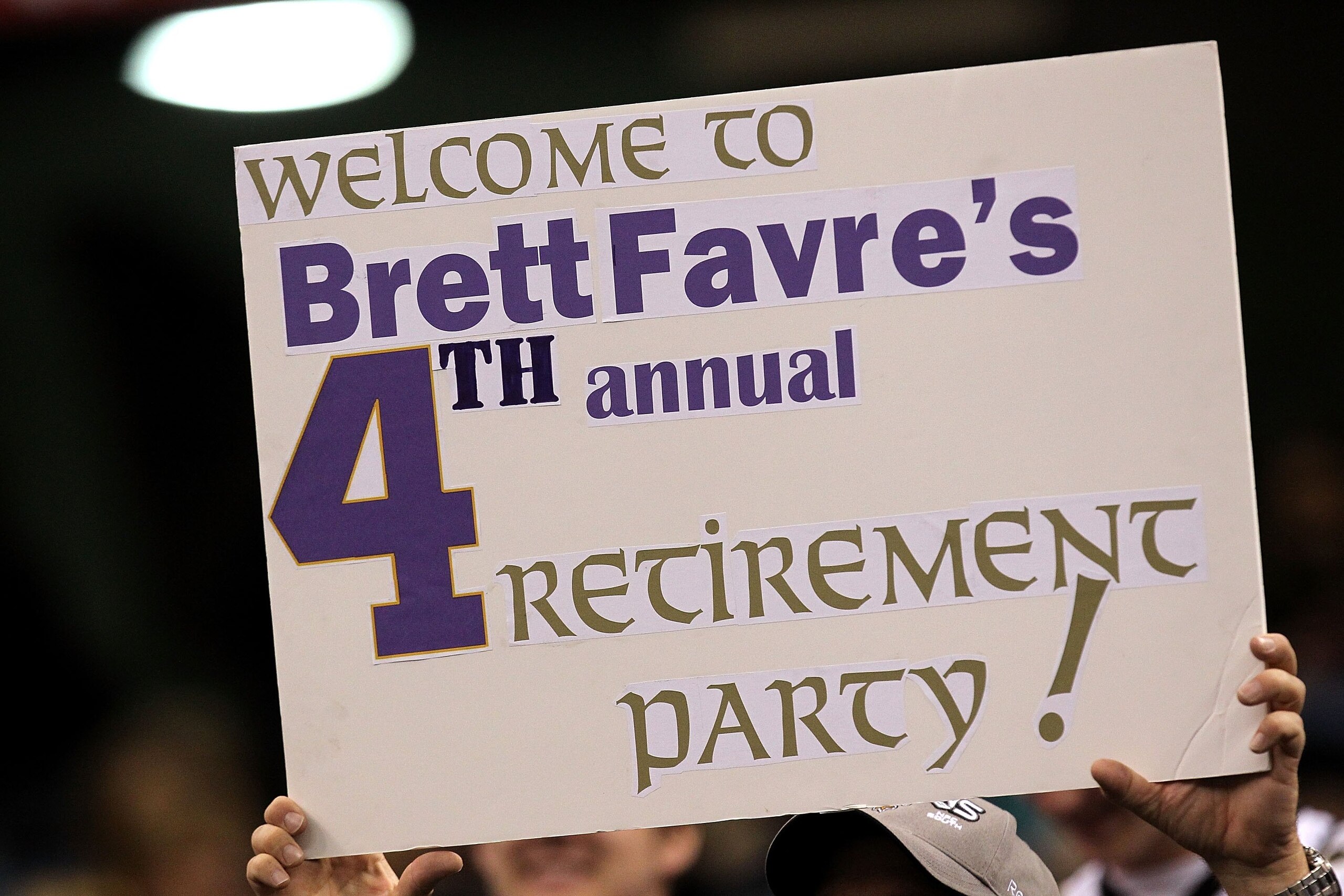 NEW ORLEANS - JANUARY 24:  A fan holds up a sign which reads 'Welcome to Brett Favre's 4th annual Retirement Party!' in reference to Brett Favre #4 of the Minnesota Vikings as he plays against the New Orleans Saints during the NFC Championship Game at the